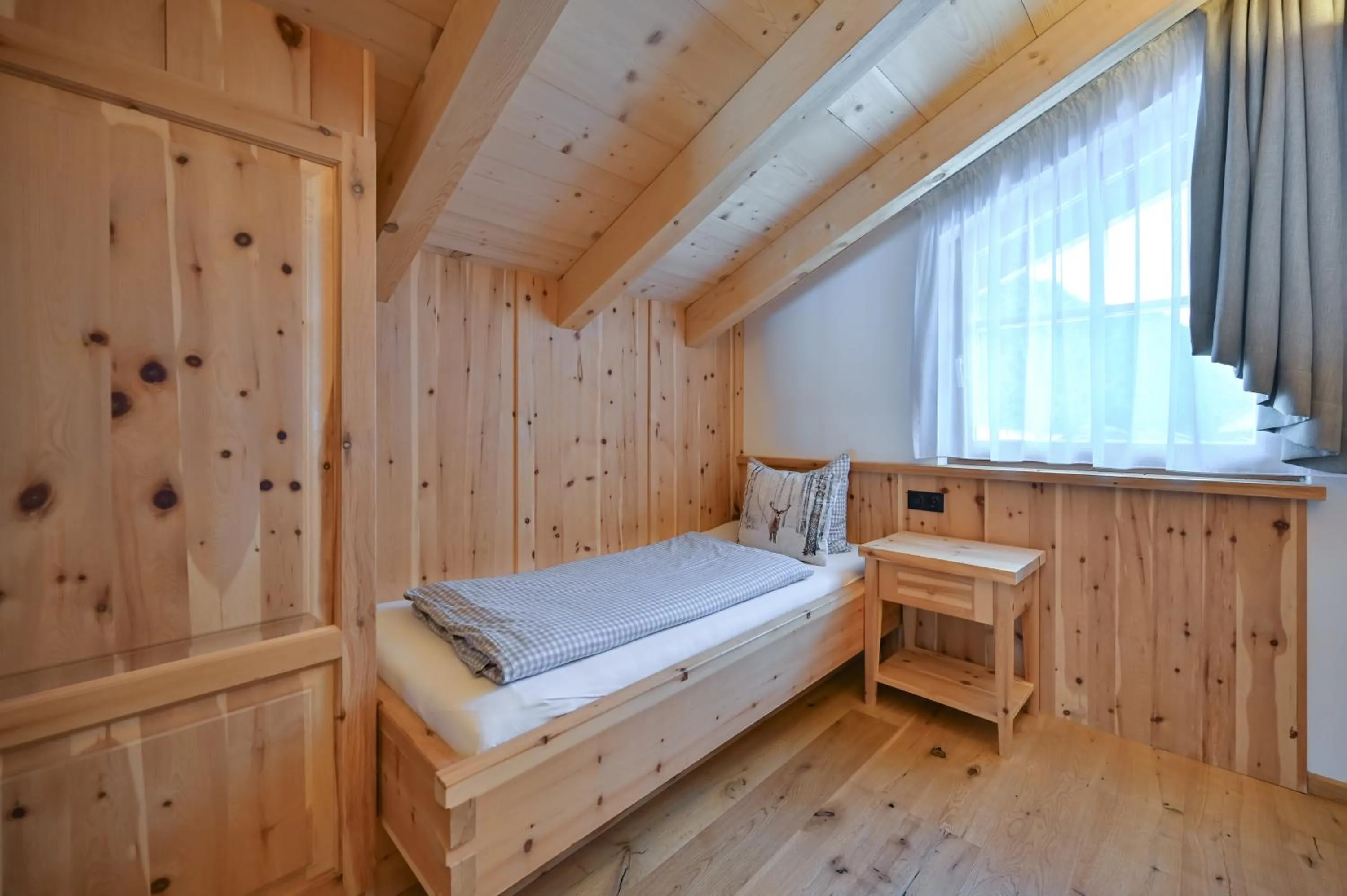 Bedroom, Bed in Braito's Seaside Lodges und Suites, Ferienhäuser und Ferienwohnungen