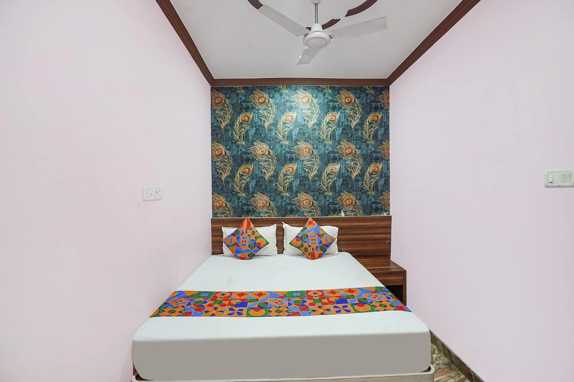 Bed in FabHotel Deepak Palace