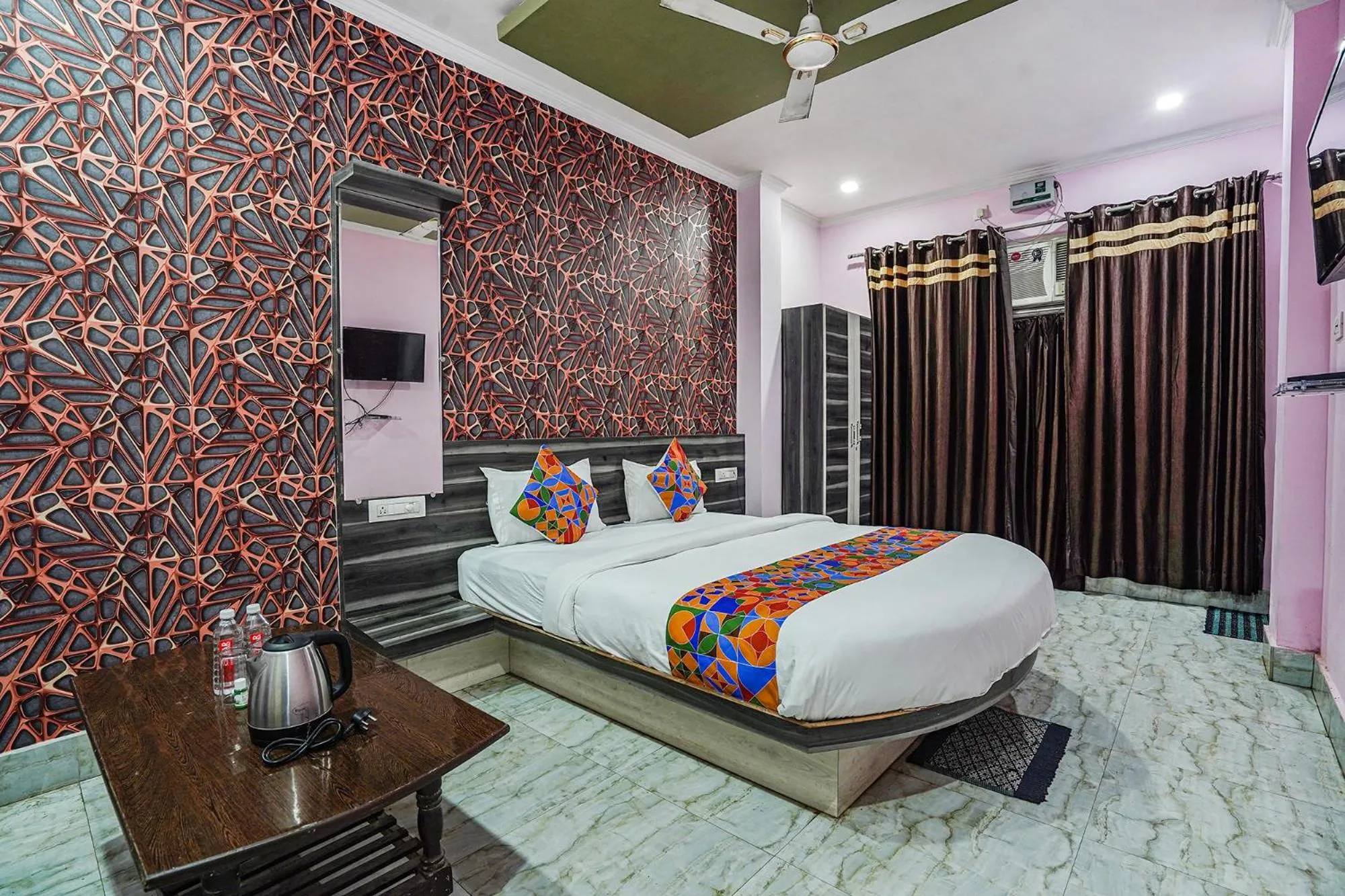 Bed in FabHotel Deepak Palace