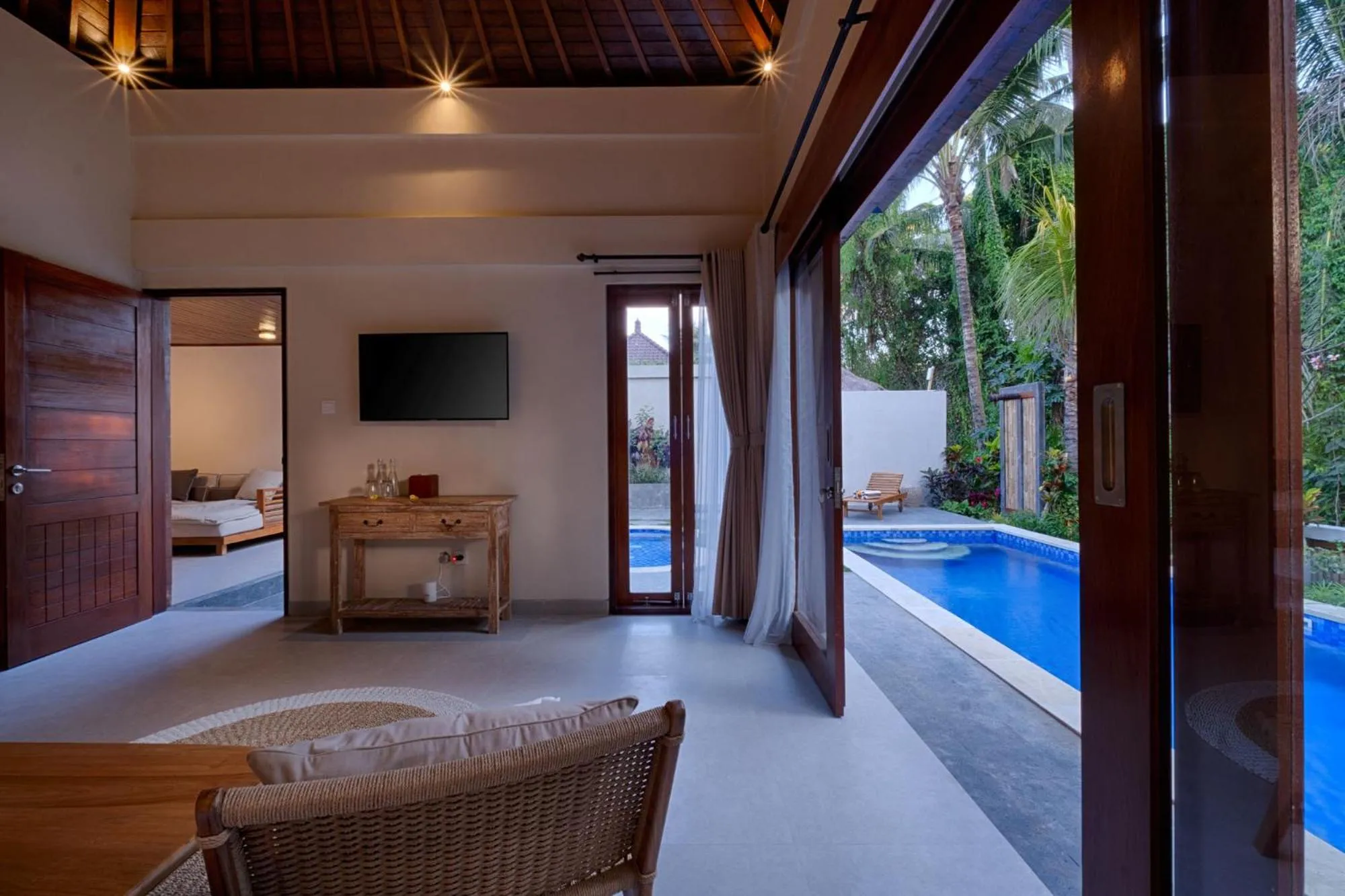 Communal lounge/ TV room in Mas Ubud Villa by Sanga Sanga Hospitality