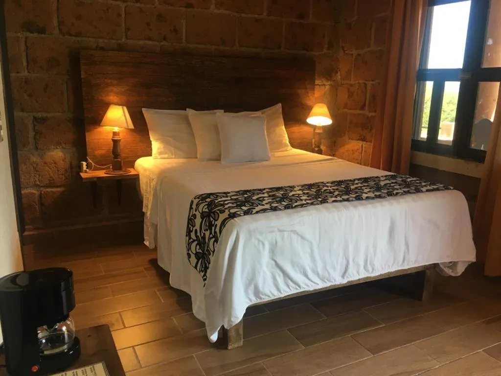 Bed in Hotel Real Nirvana