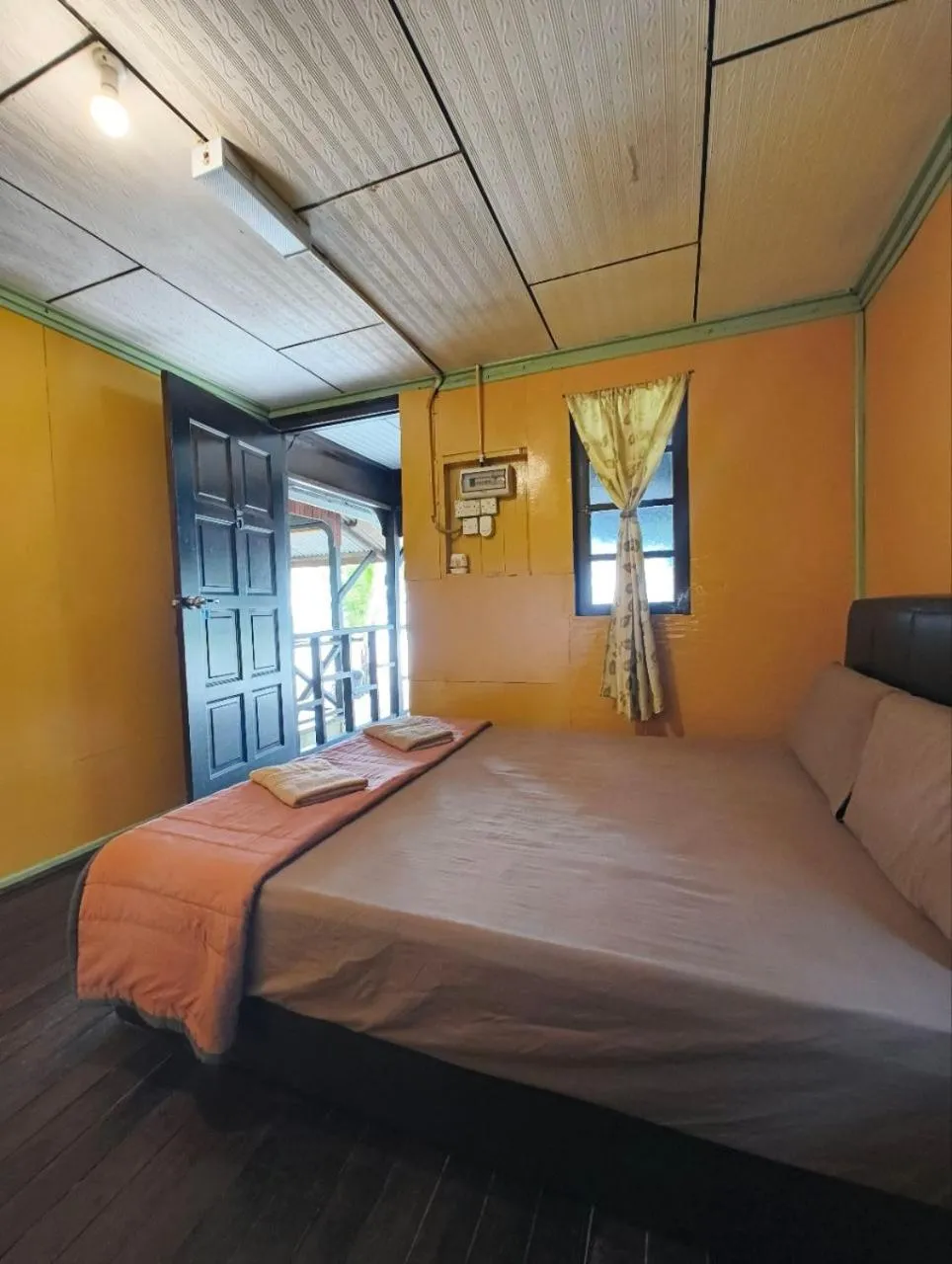 Bed in Rainbow Tioman Cottage
