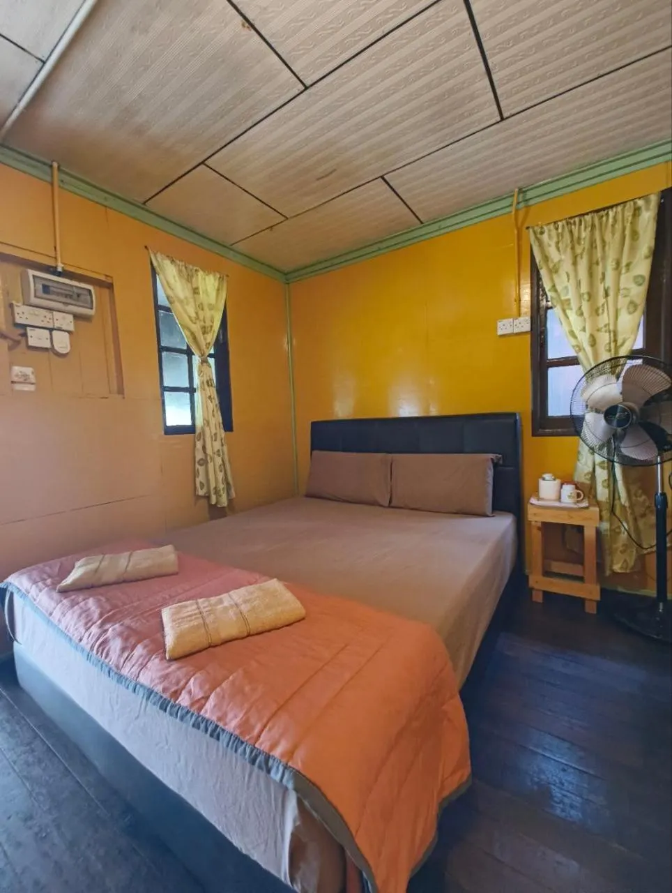 Bed in Rainbow Tioman Cottage