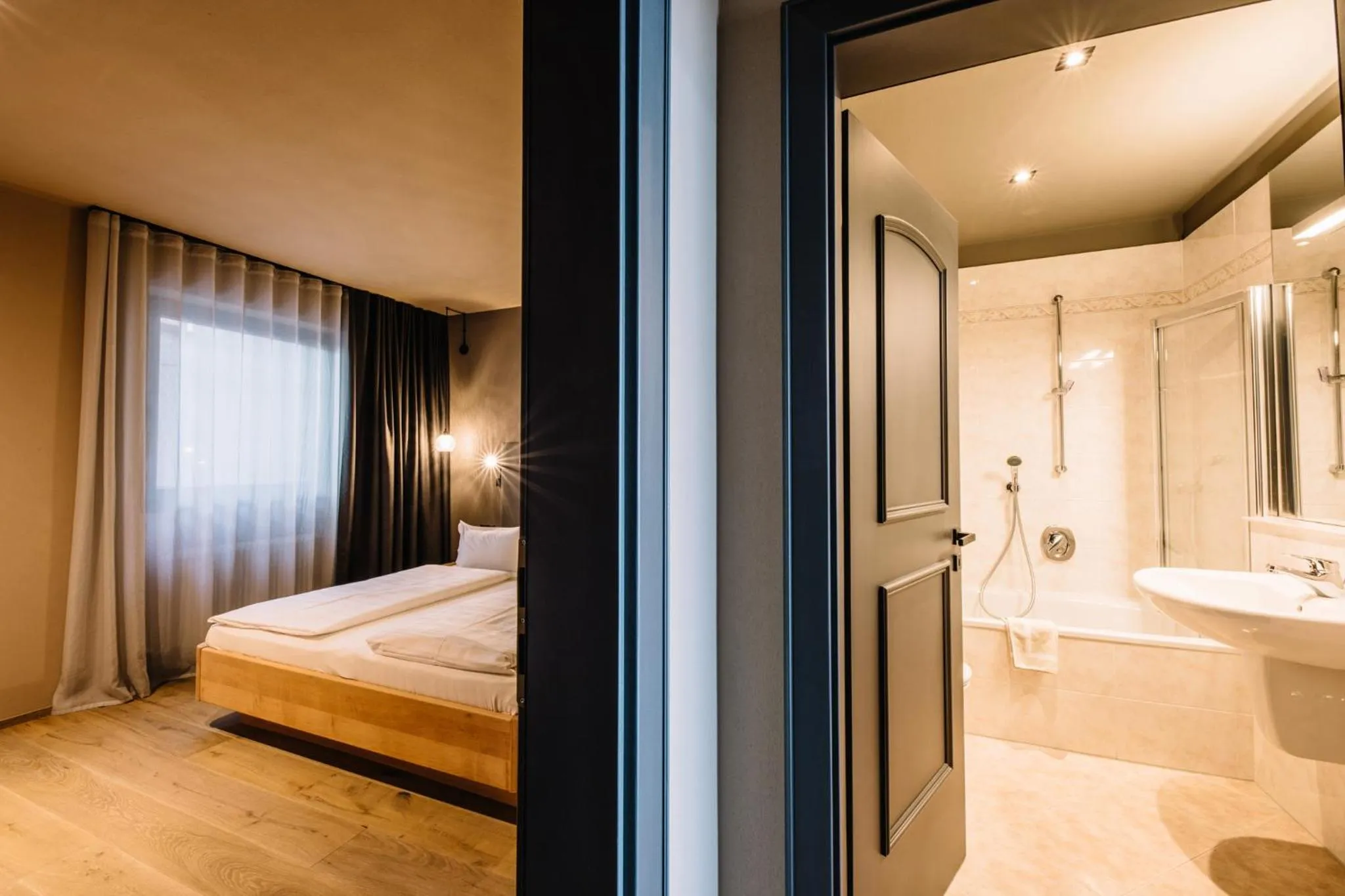 Bathroom, Bed in Panoramic Suites Winzerhöhe