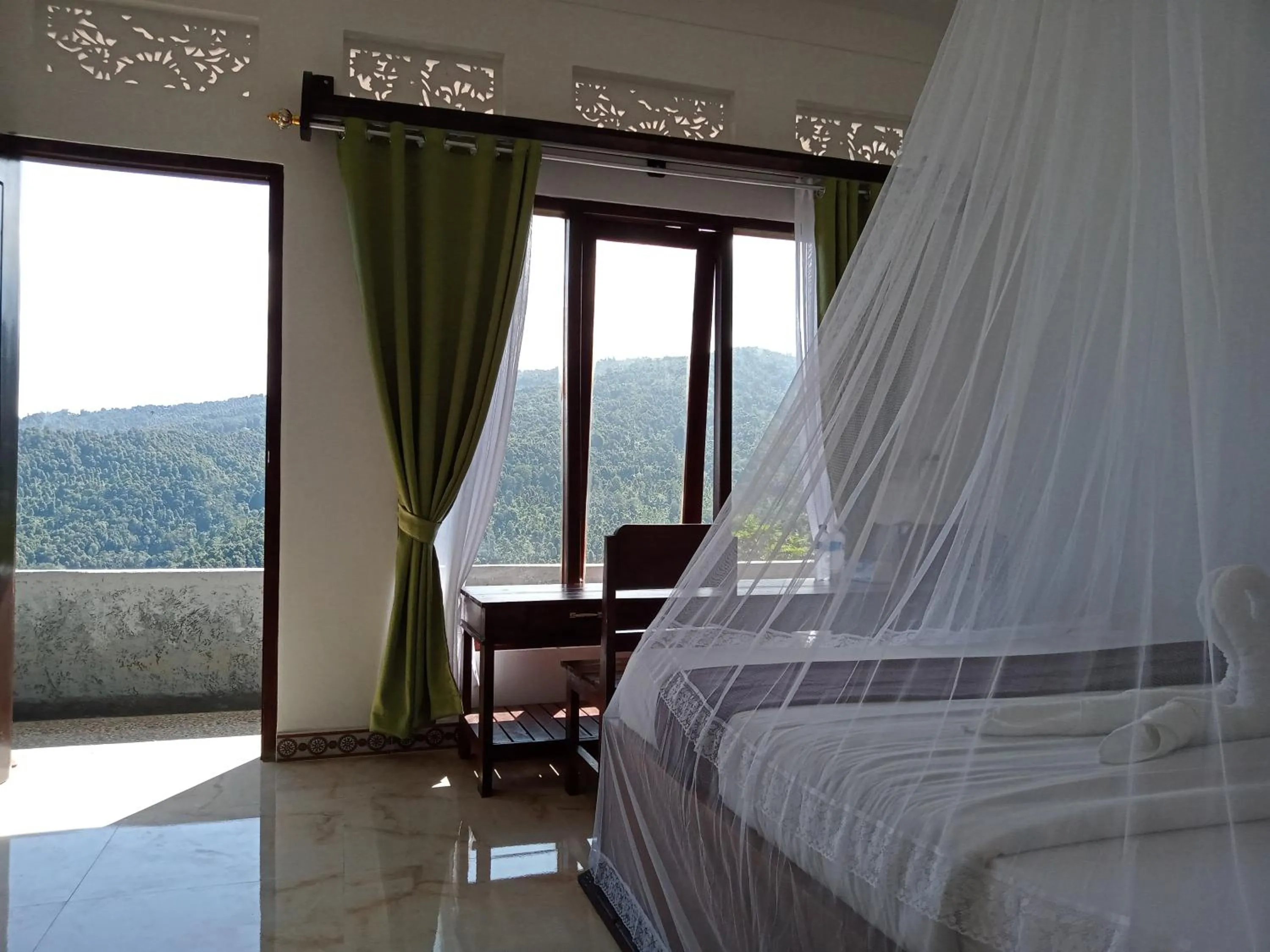 Bed in Aris Homestay and Warung Made