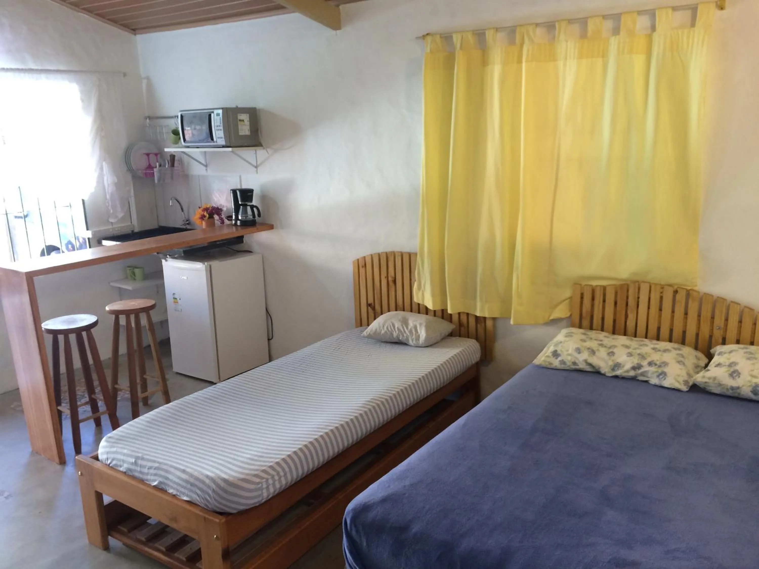 Bed in Kitchenette Charmosa no Itagua