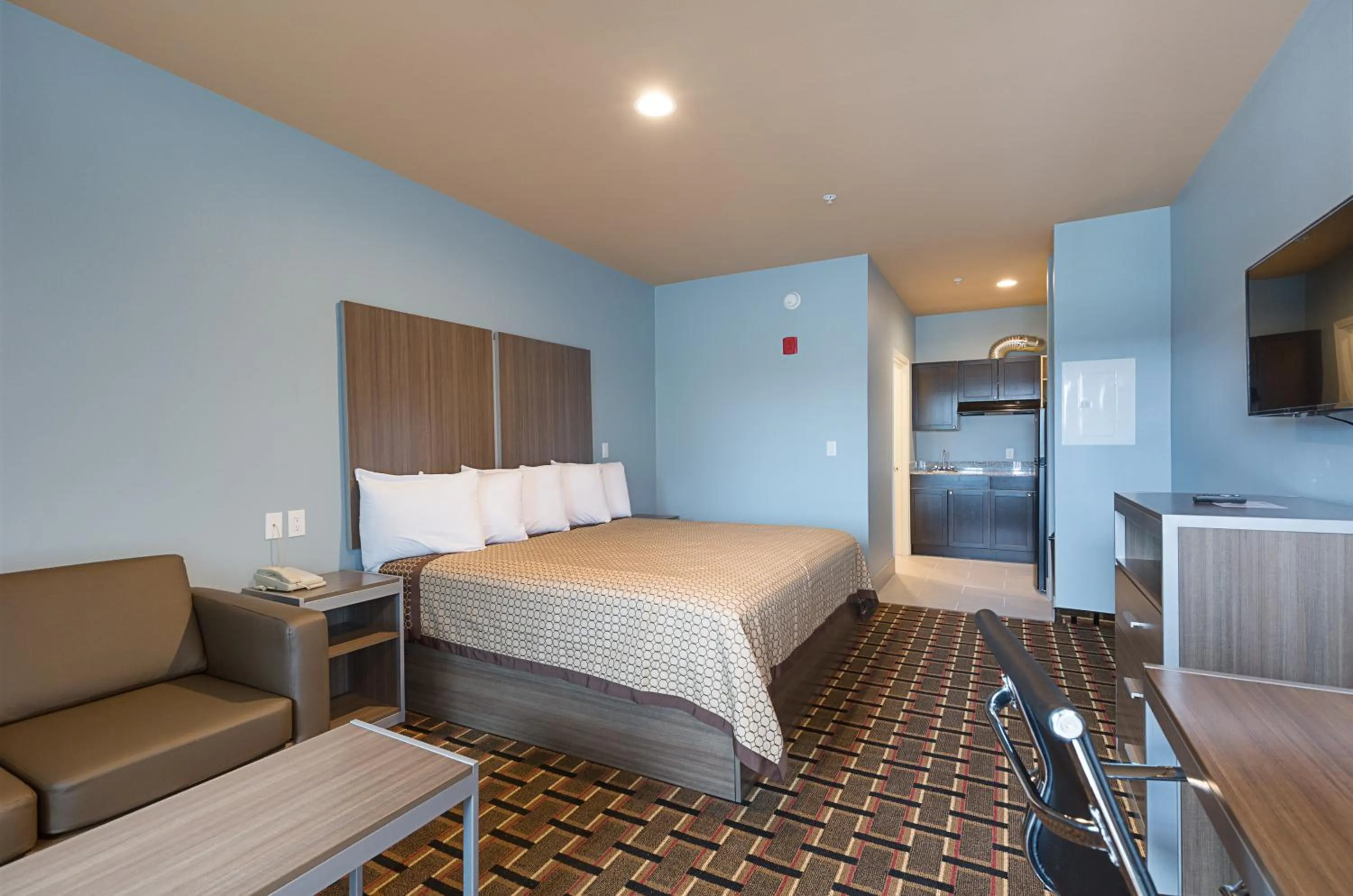 Bed in Scottish Inns & Suites - Crosby