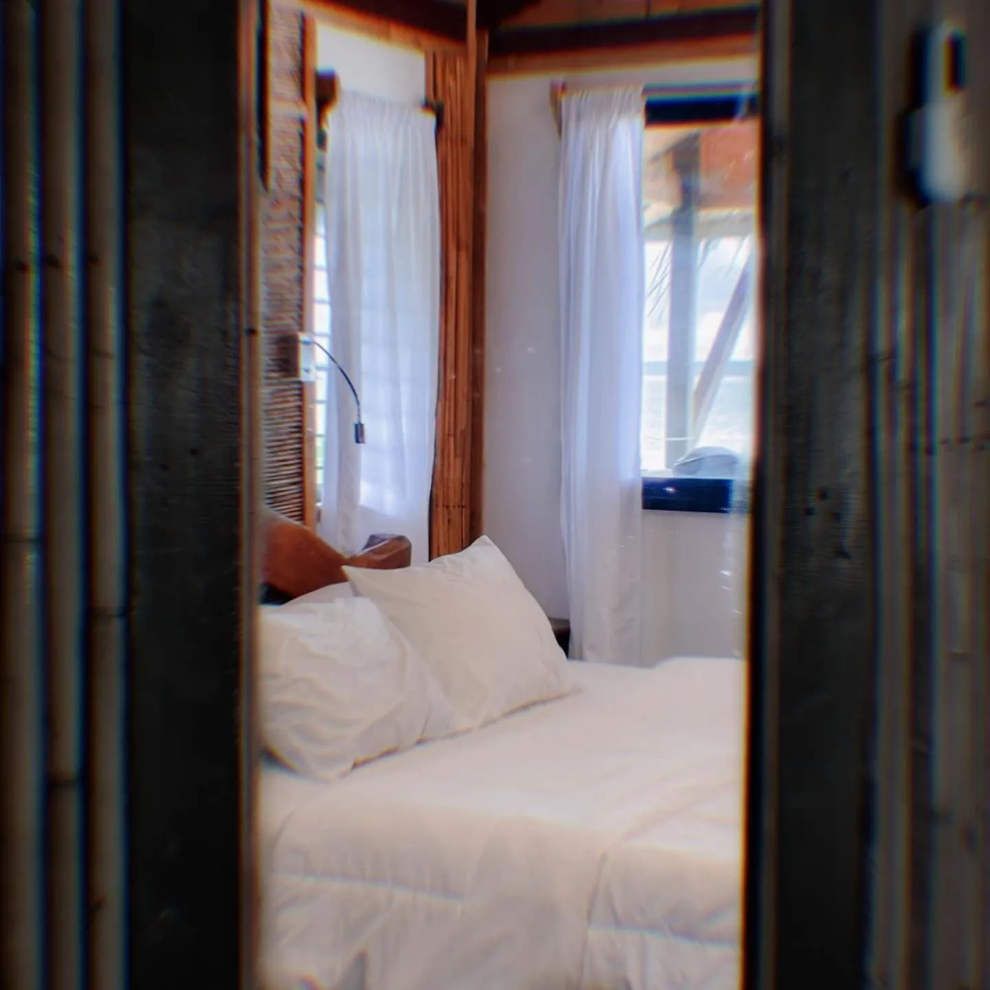 Bed in Patrick's on the Beach Resort