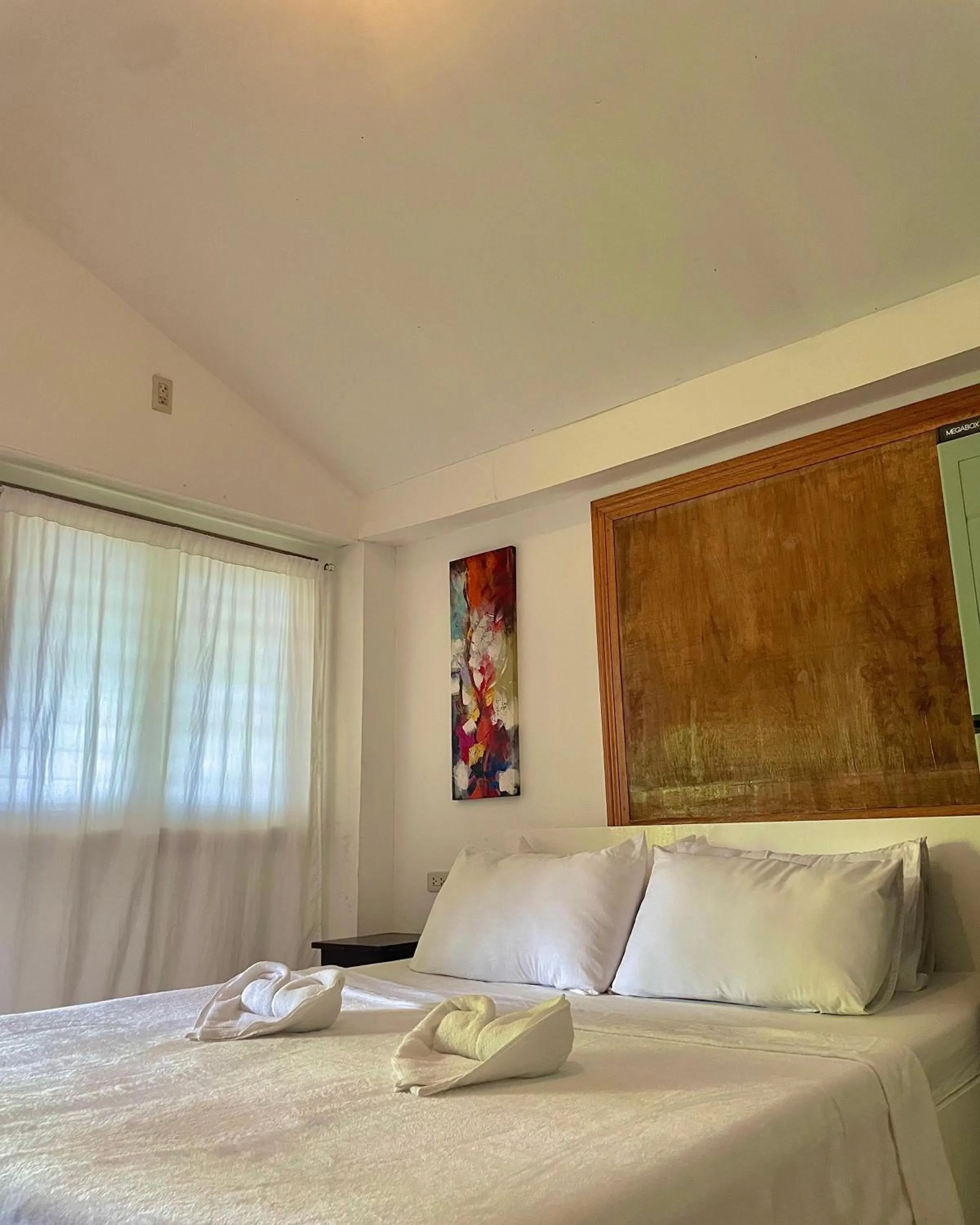 Bed in Patrick's on the Beach Resort