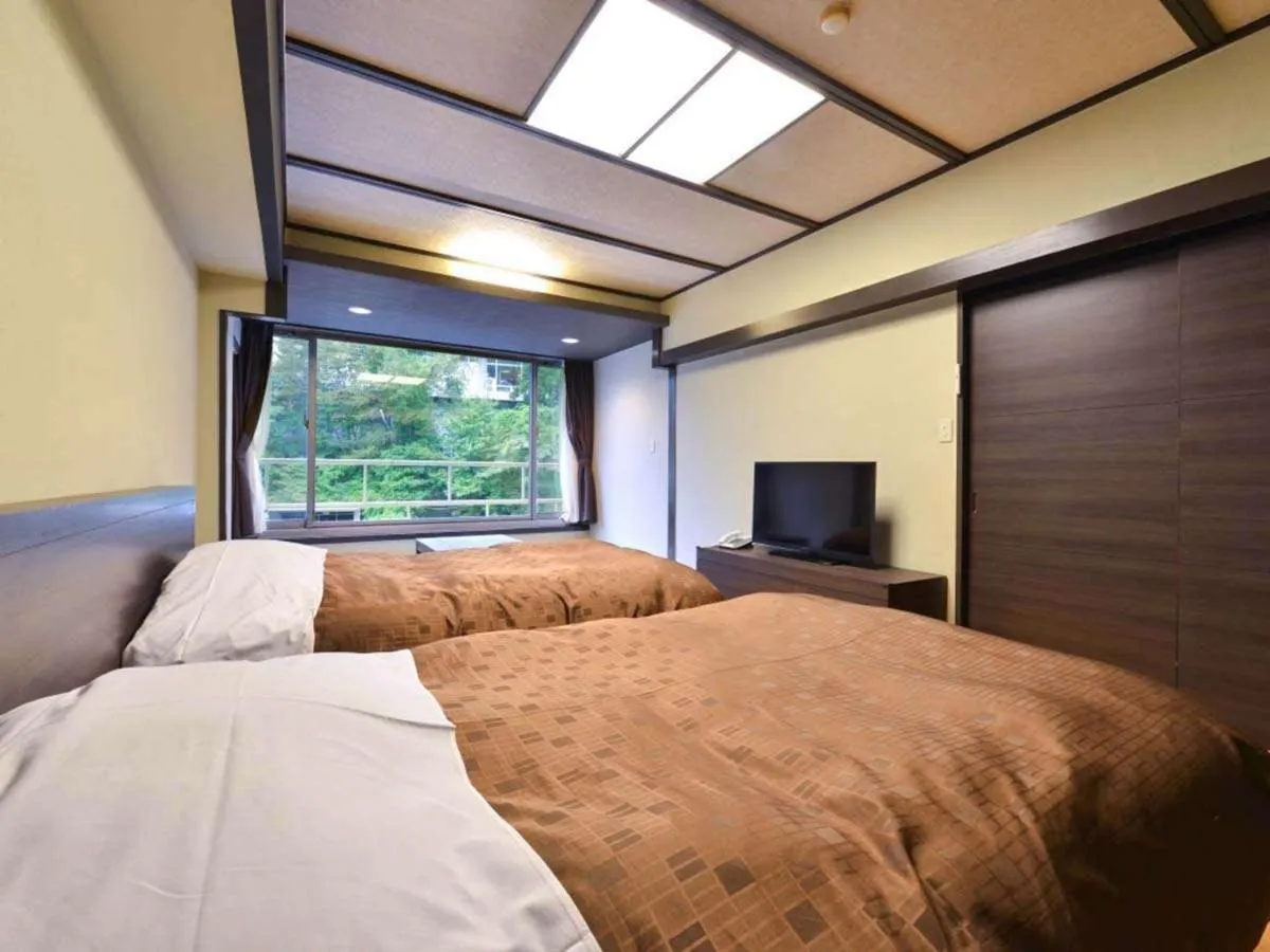 Bed in Ooedo Onsen Monogatari Premium Hotel New Shiobara