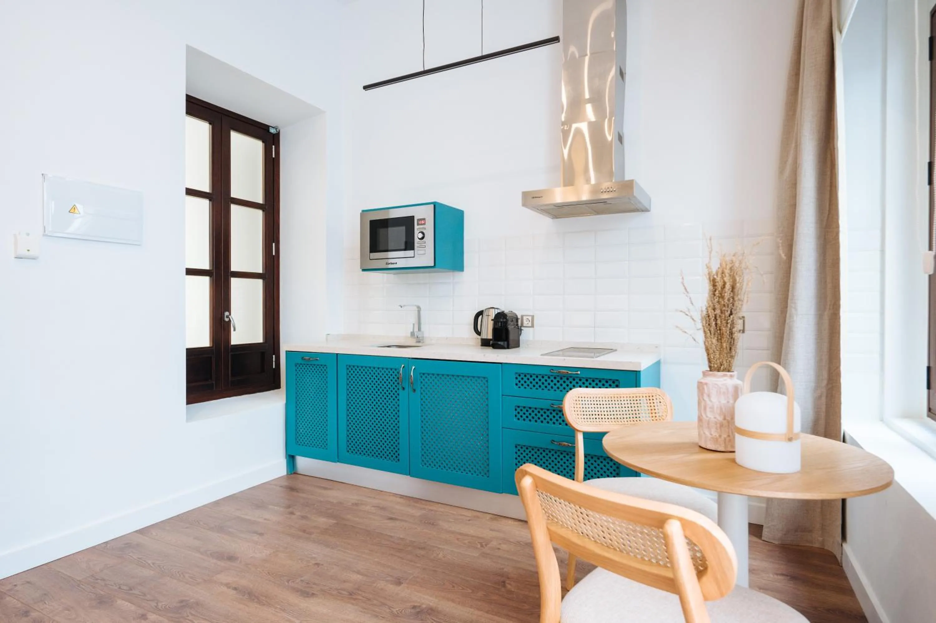 Kitchen or kitchenette in Apartamentos "El Escondite de María"