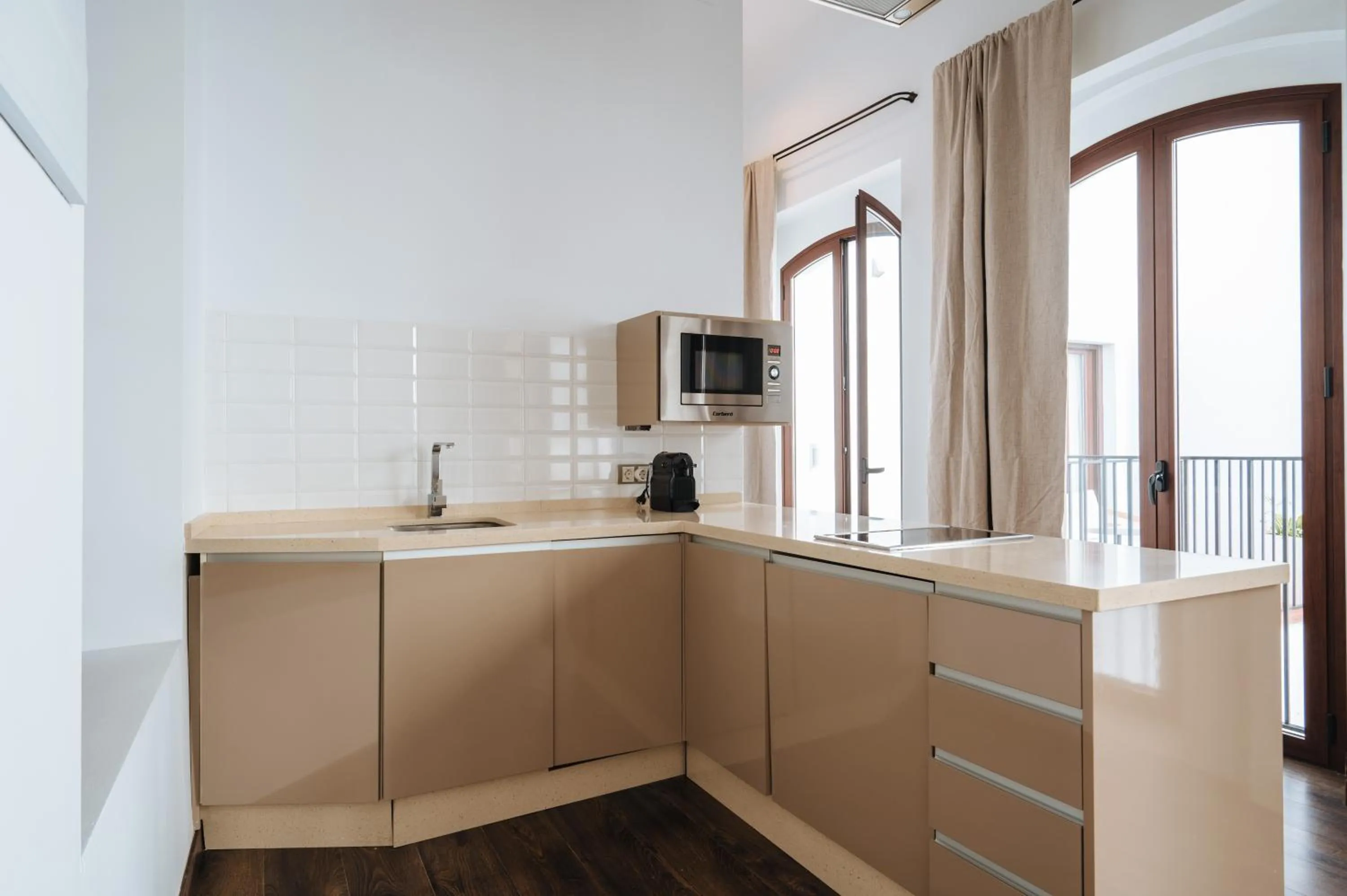 Kitchen or kitchenette in Apartamentos "El Escondite de María"