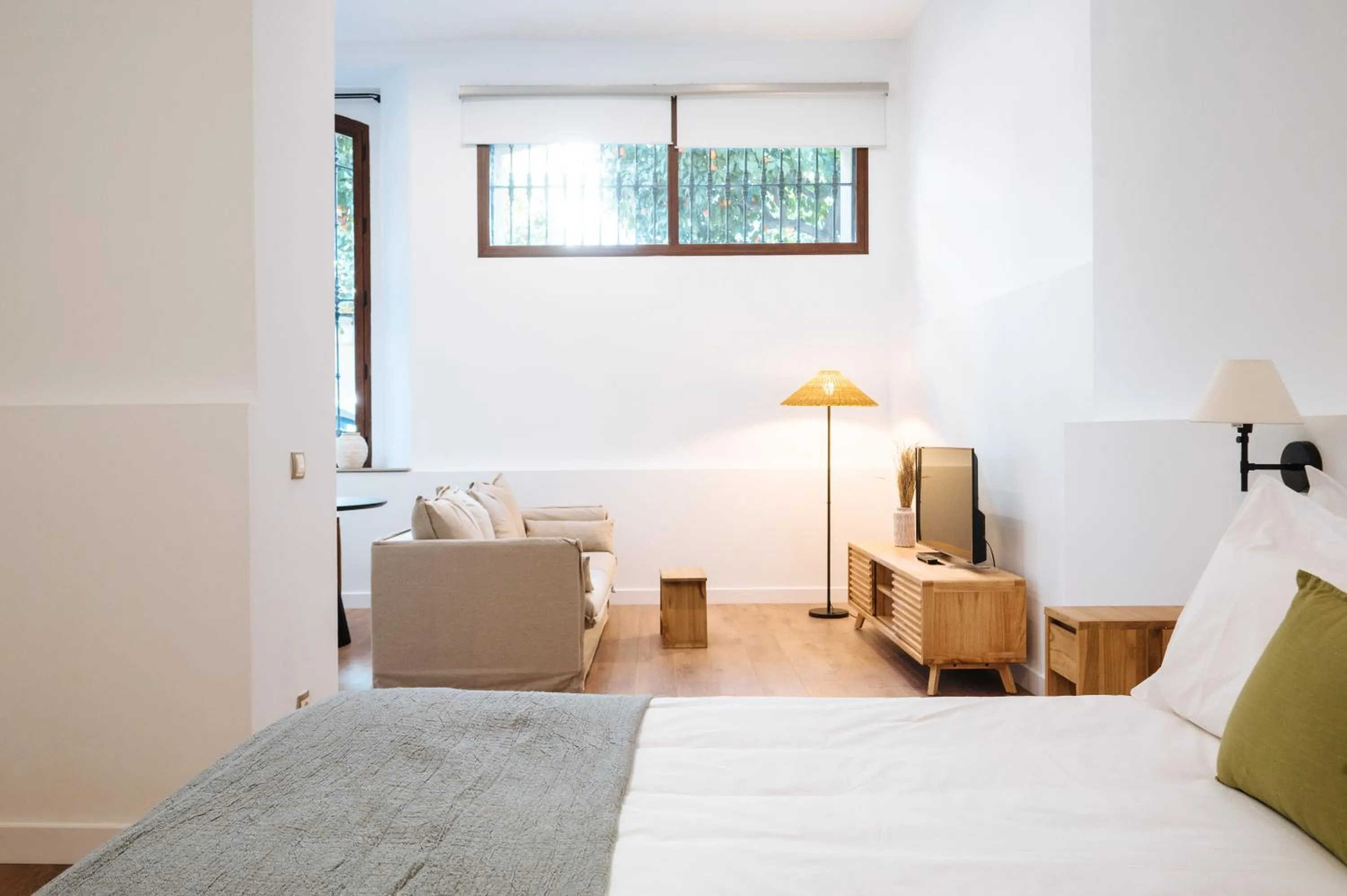 Living room, Bed in Apartamentos "El Escondite de María"