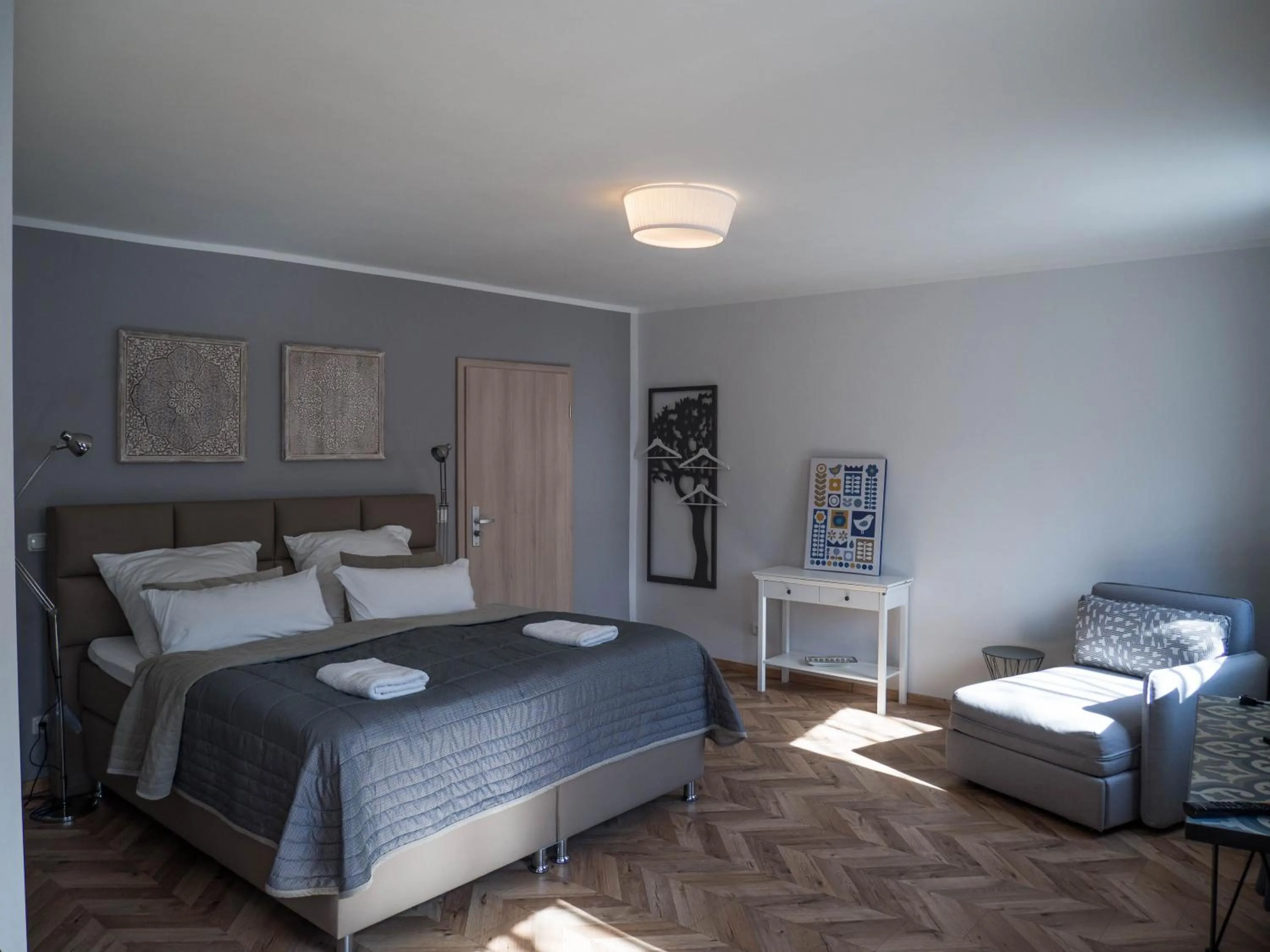 Photo of the whole room, Bed in TM Suites