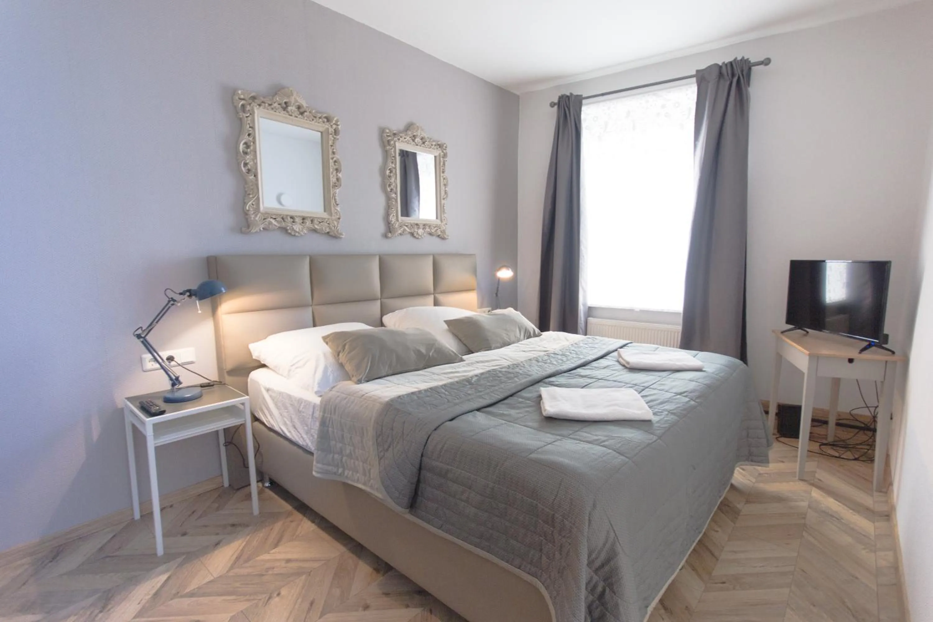 Photo of the whole room, Bed in TM Suites