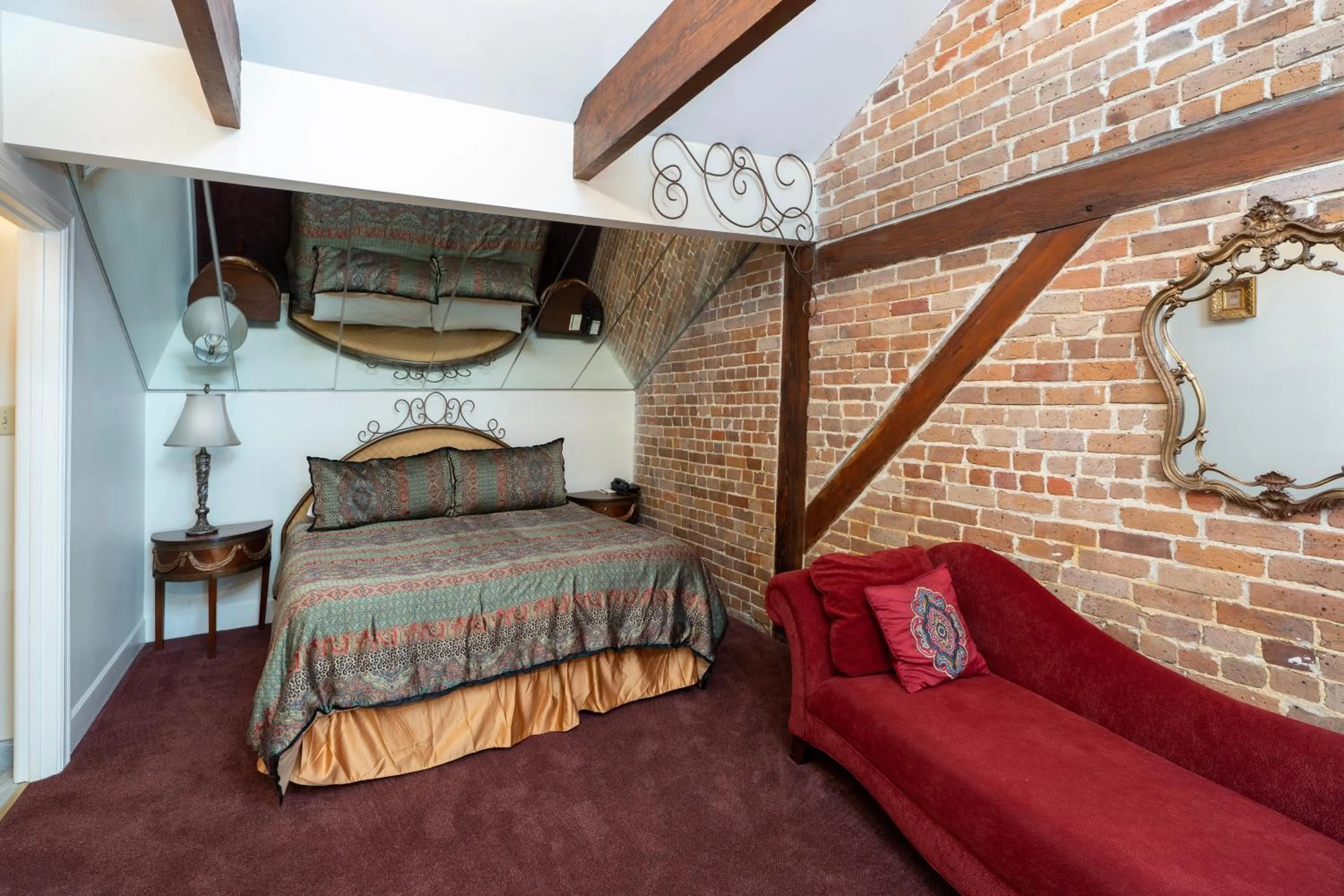 Bed in Quarter House Suites