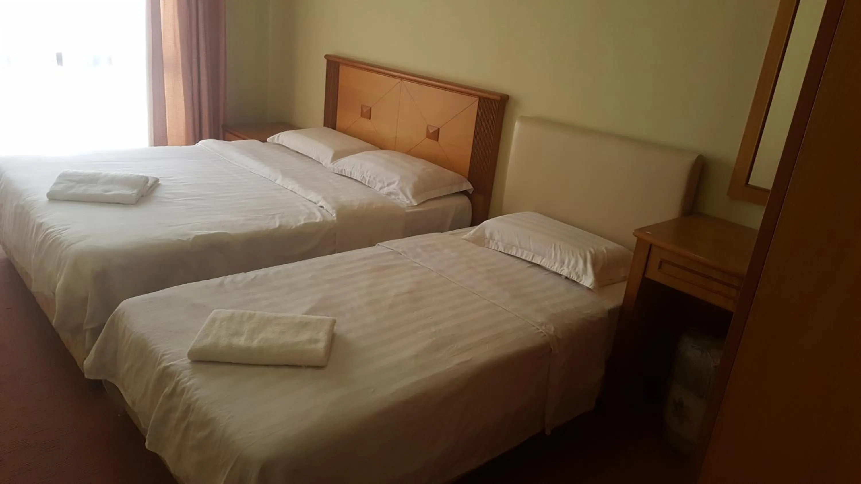 Bed in Homestay Marina Court Resort