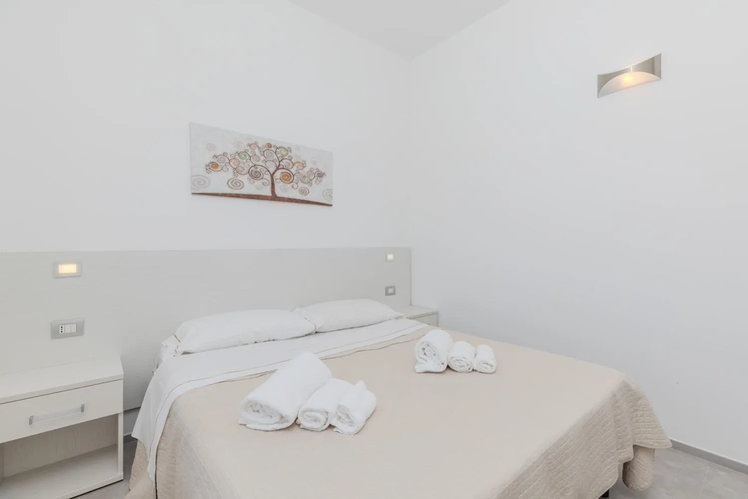 Bed in Antares Rooms and Suites