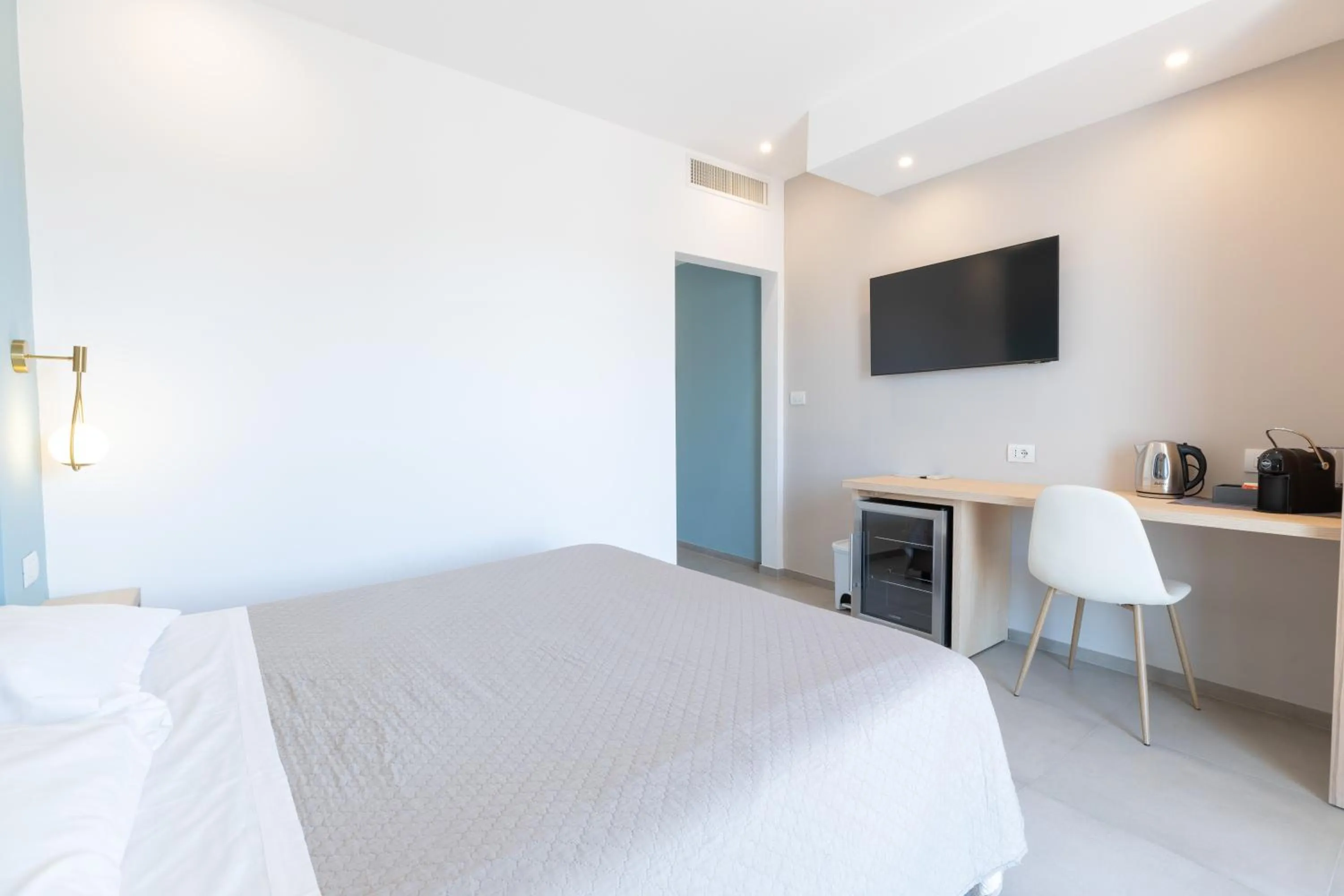 Bed in Antares Rooms and Suites