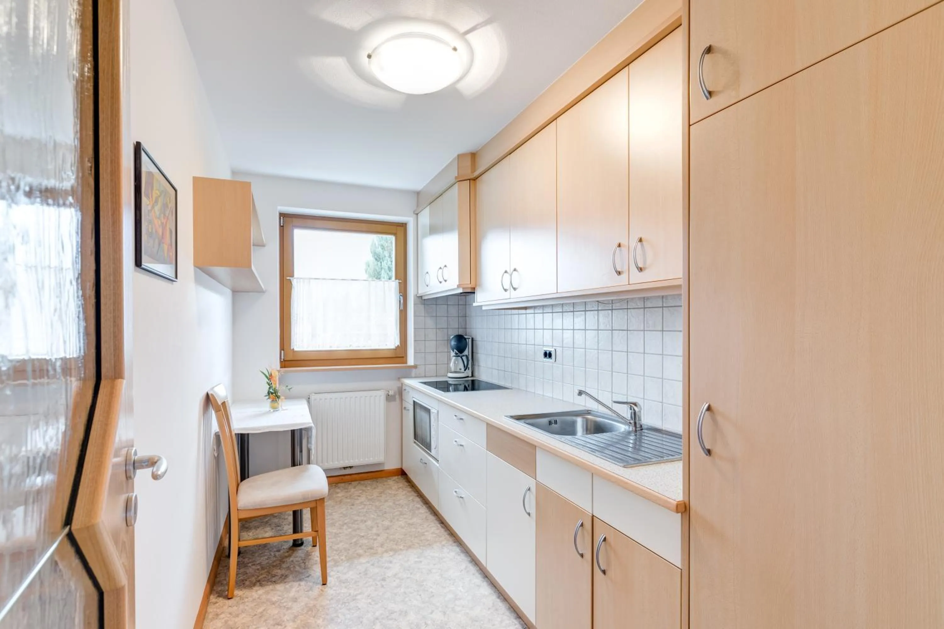 Kitchen or kitchenette in Pension Haus am See