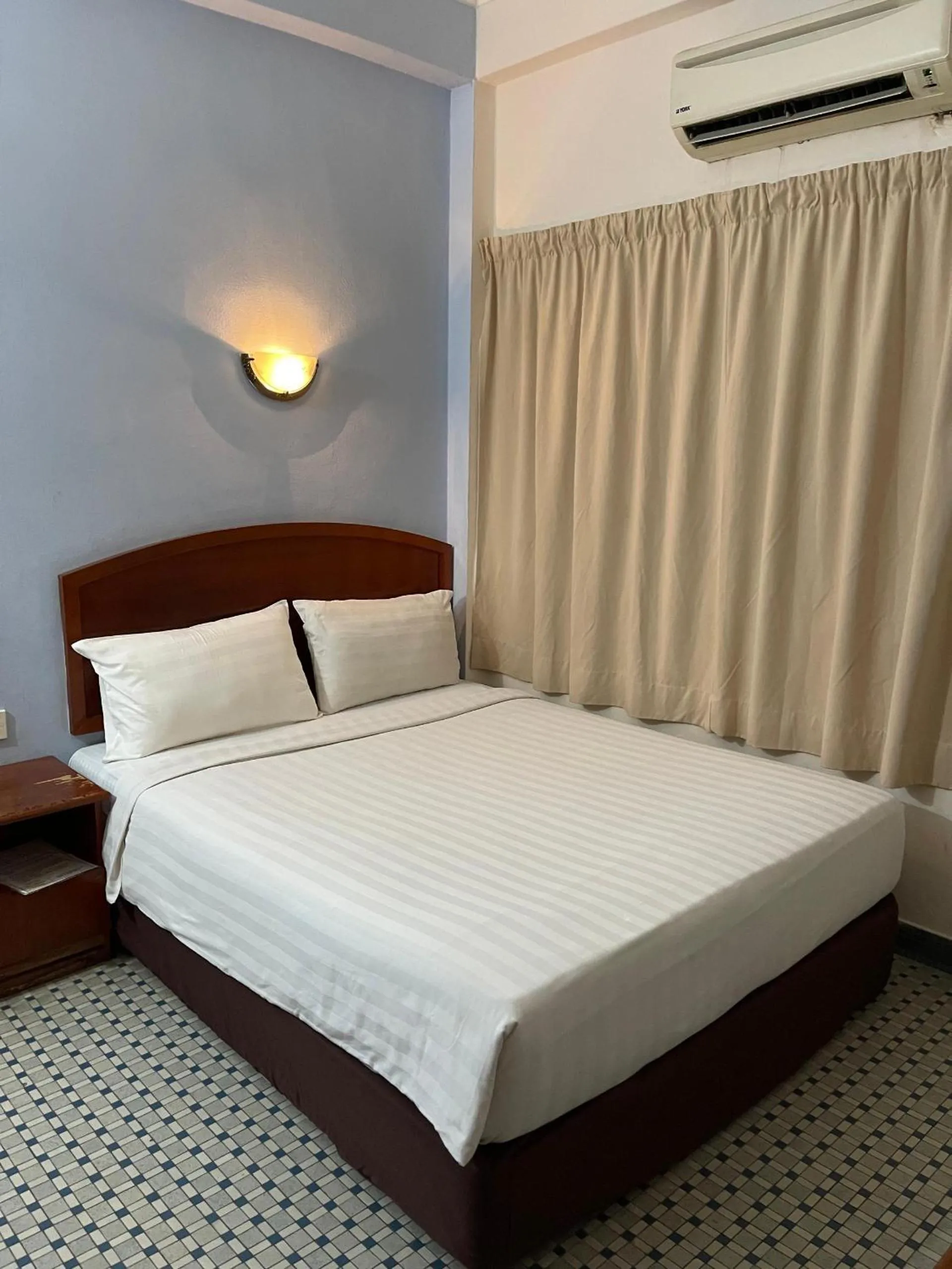 Bed in New Caspian Hotel