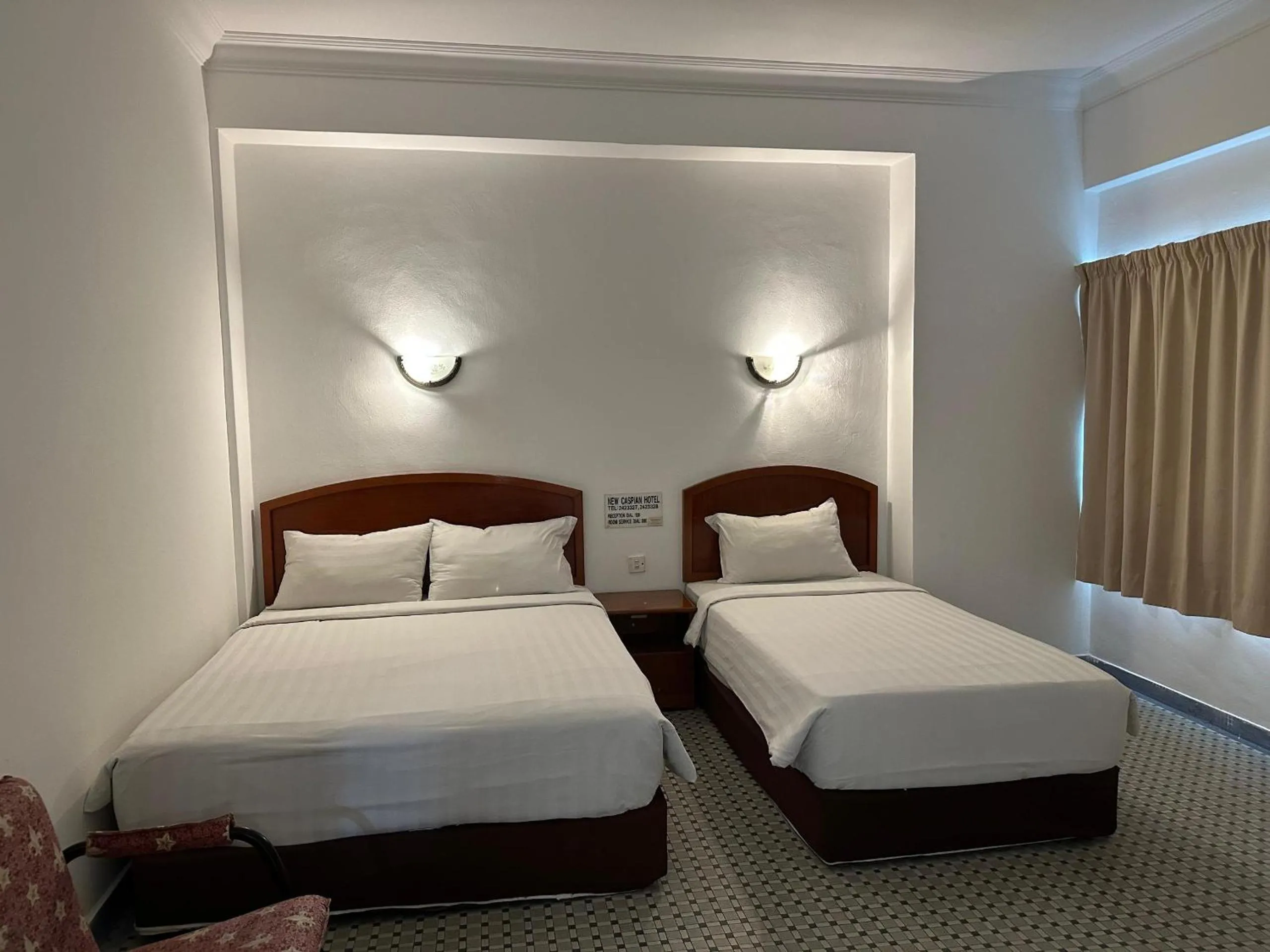 Bed in New Caspian Hotel
