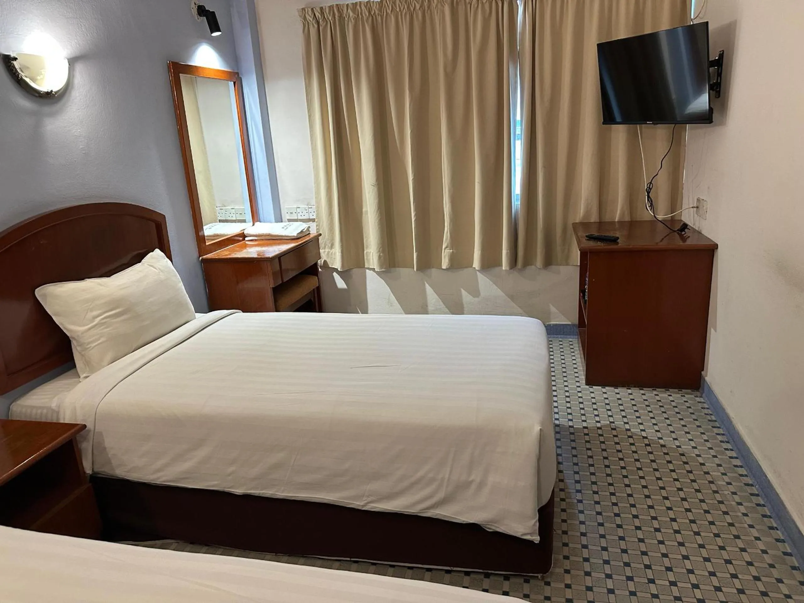 Bed in New Caspian Hotel