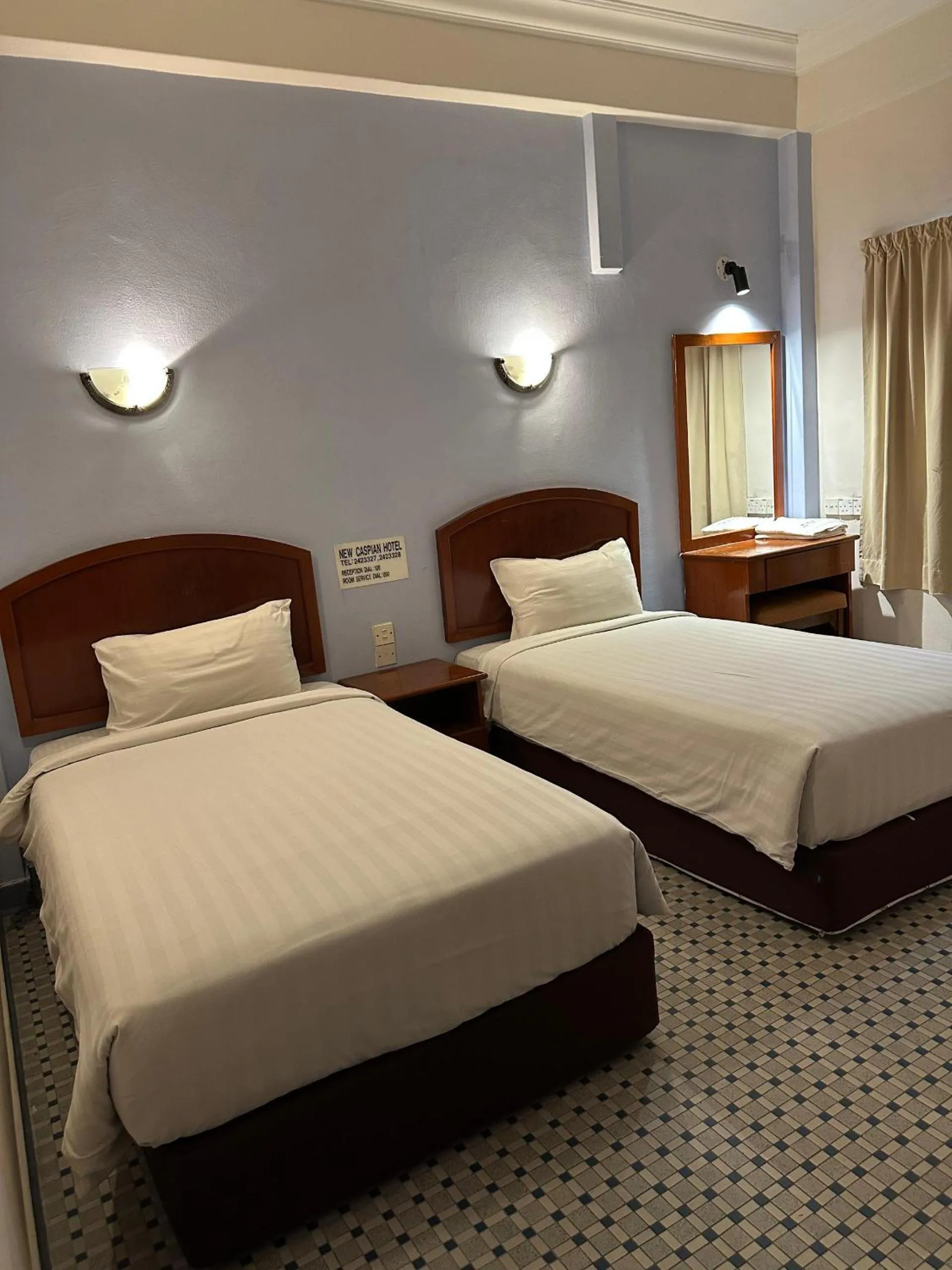 Bed in New Caspian Hotel