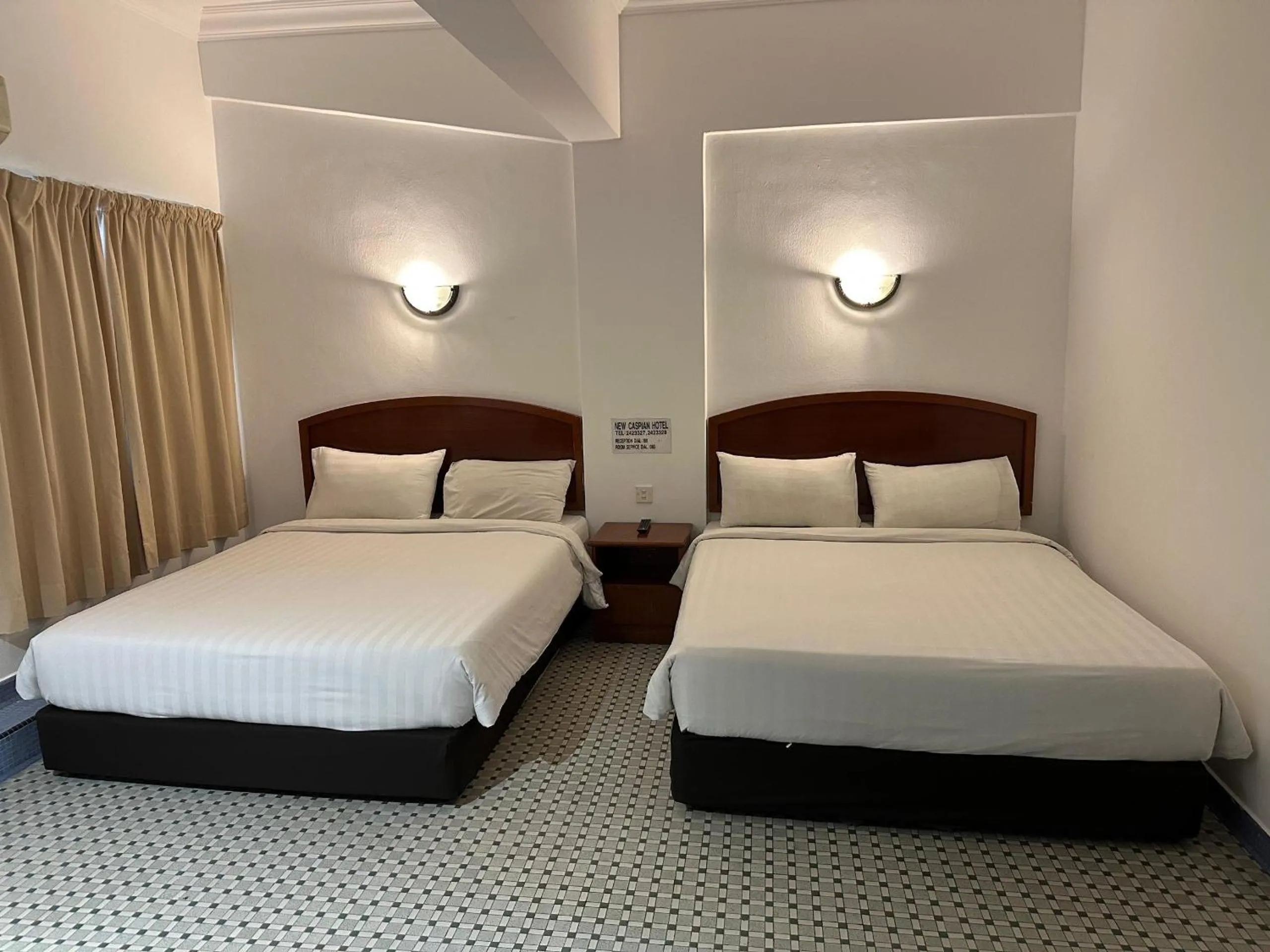 Bed in New Caspian Hotel