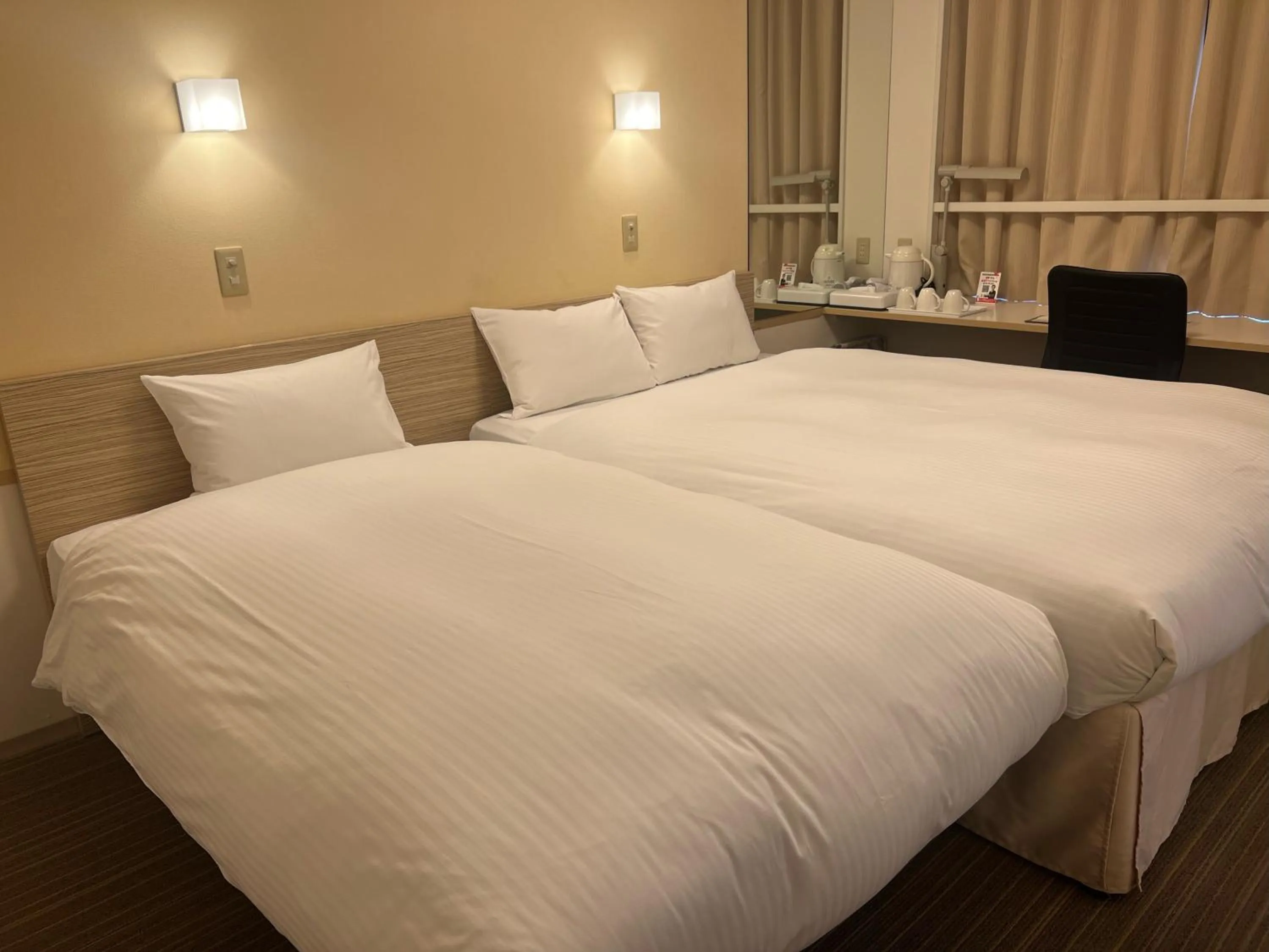 Bed in Smile Hotel Shirakawa