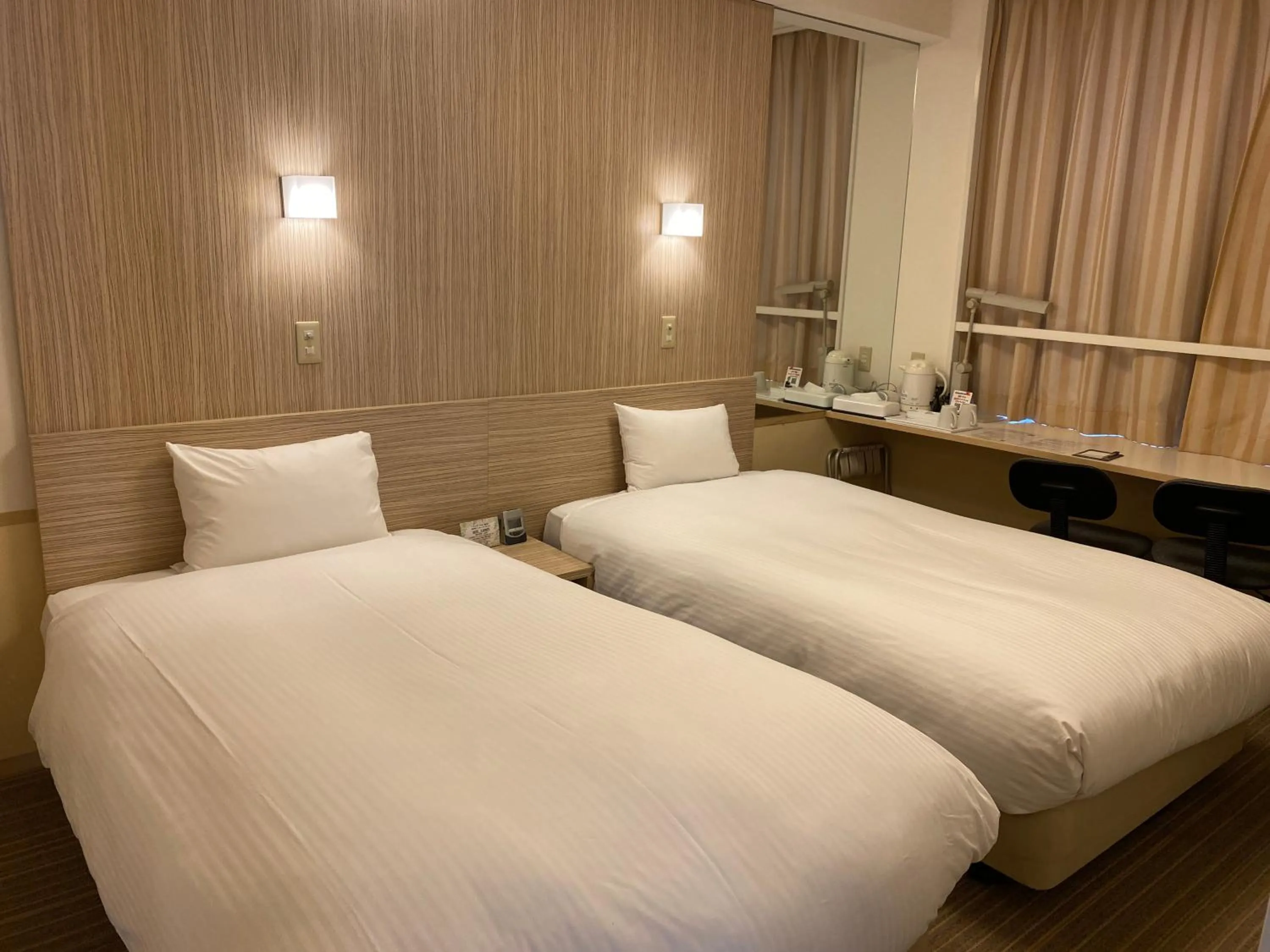 Bed in Smile Hotel Shirakawa