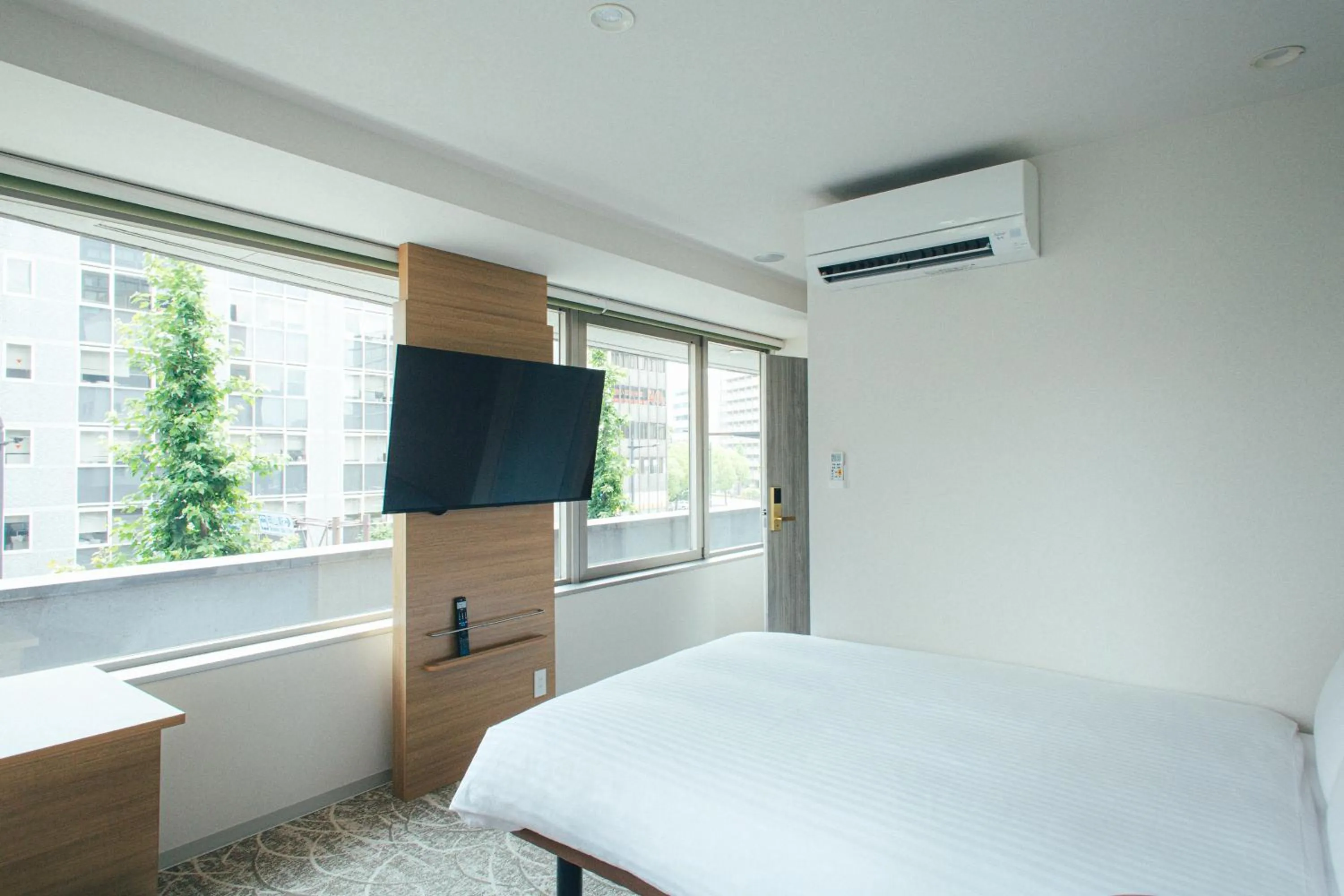 Bed in Kuretake Inn Okayama