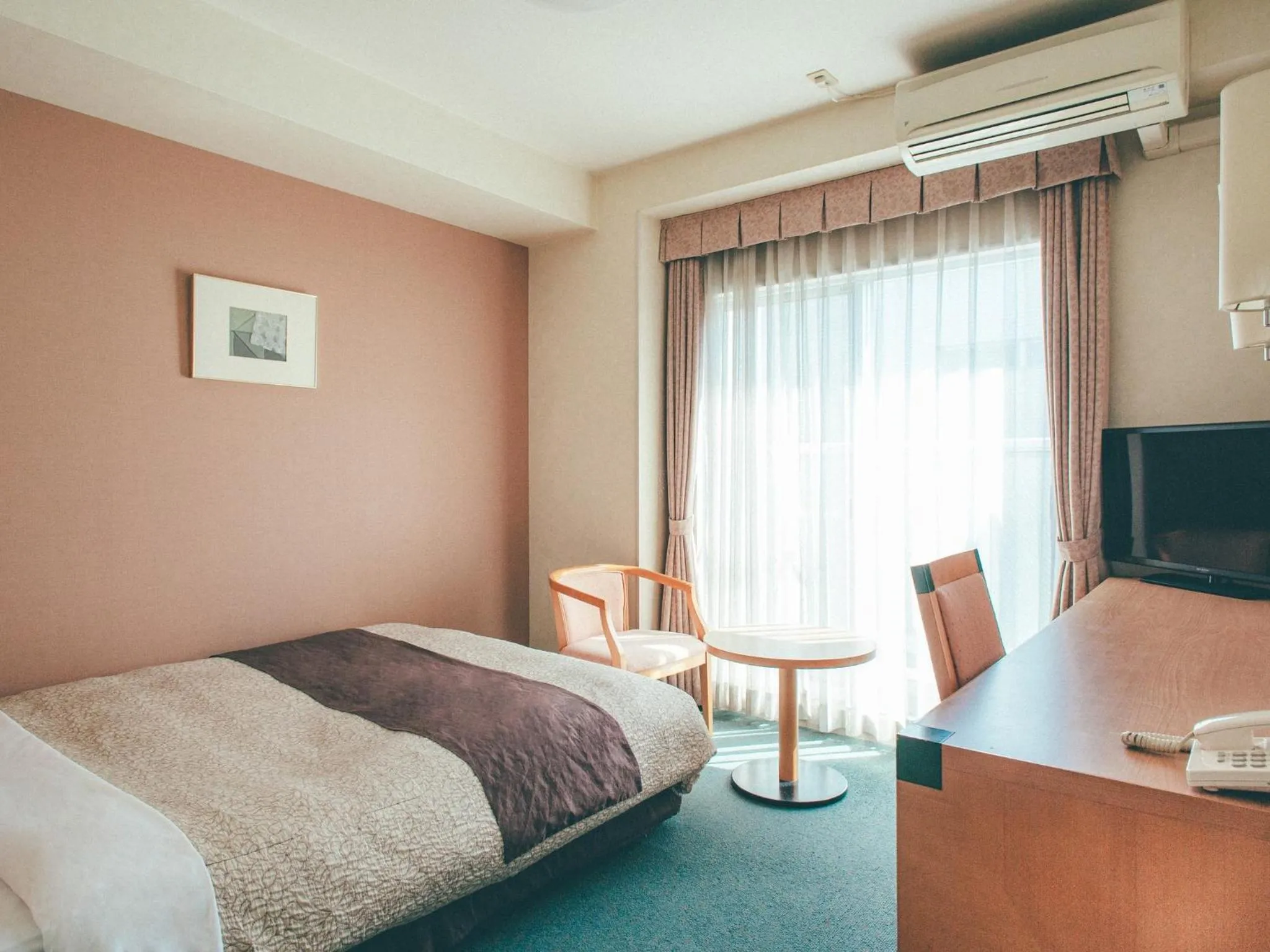 Bed in Kuretake Inn Okayama