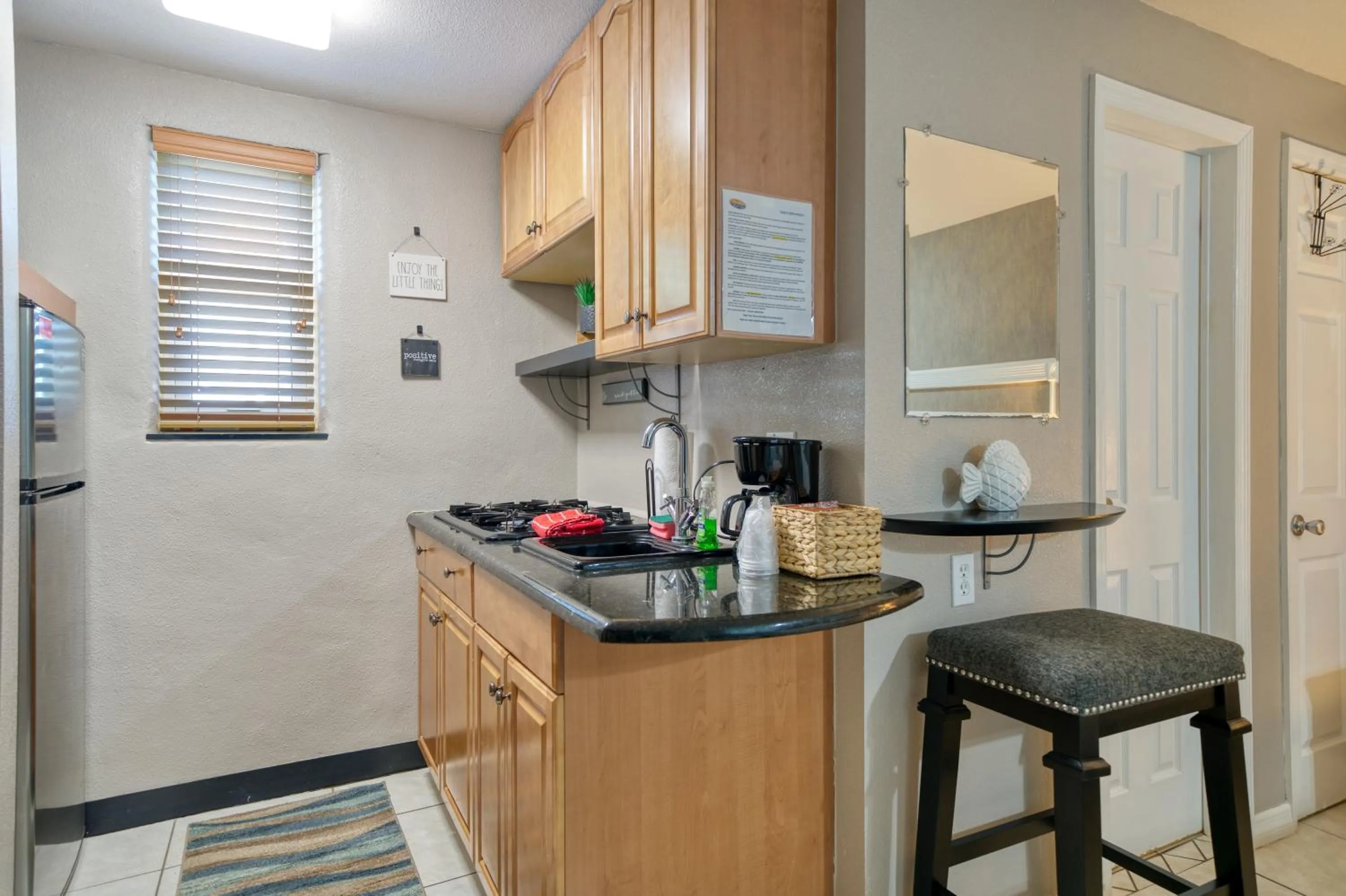 Kitchen or kitchenette in Camelot Beach Suites