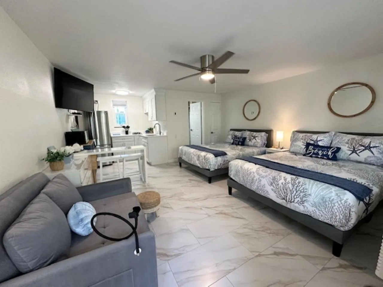 Bed in Camelot Beach Suites