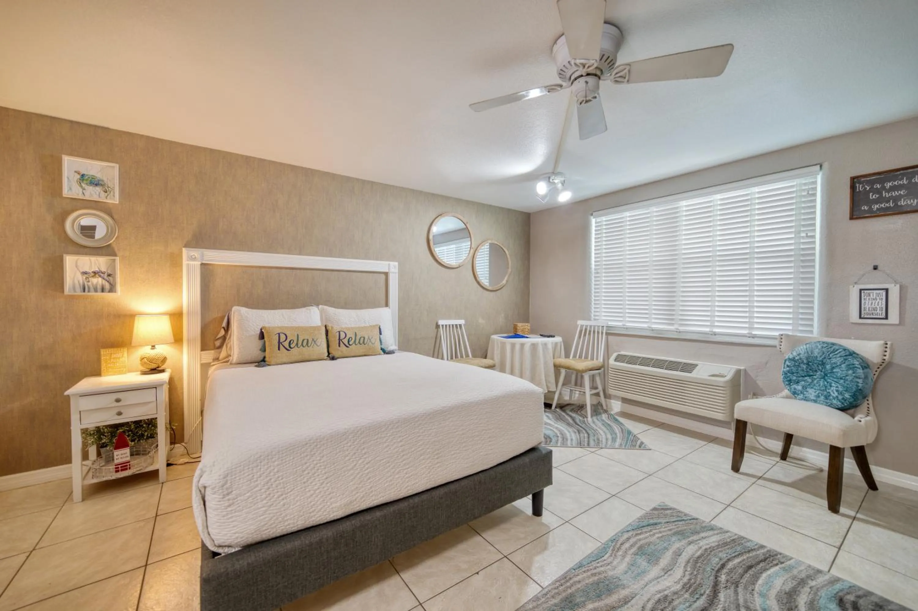 Bed in Camelot Beach Suites