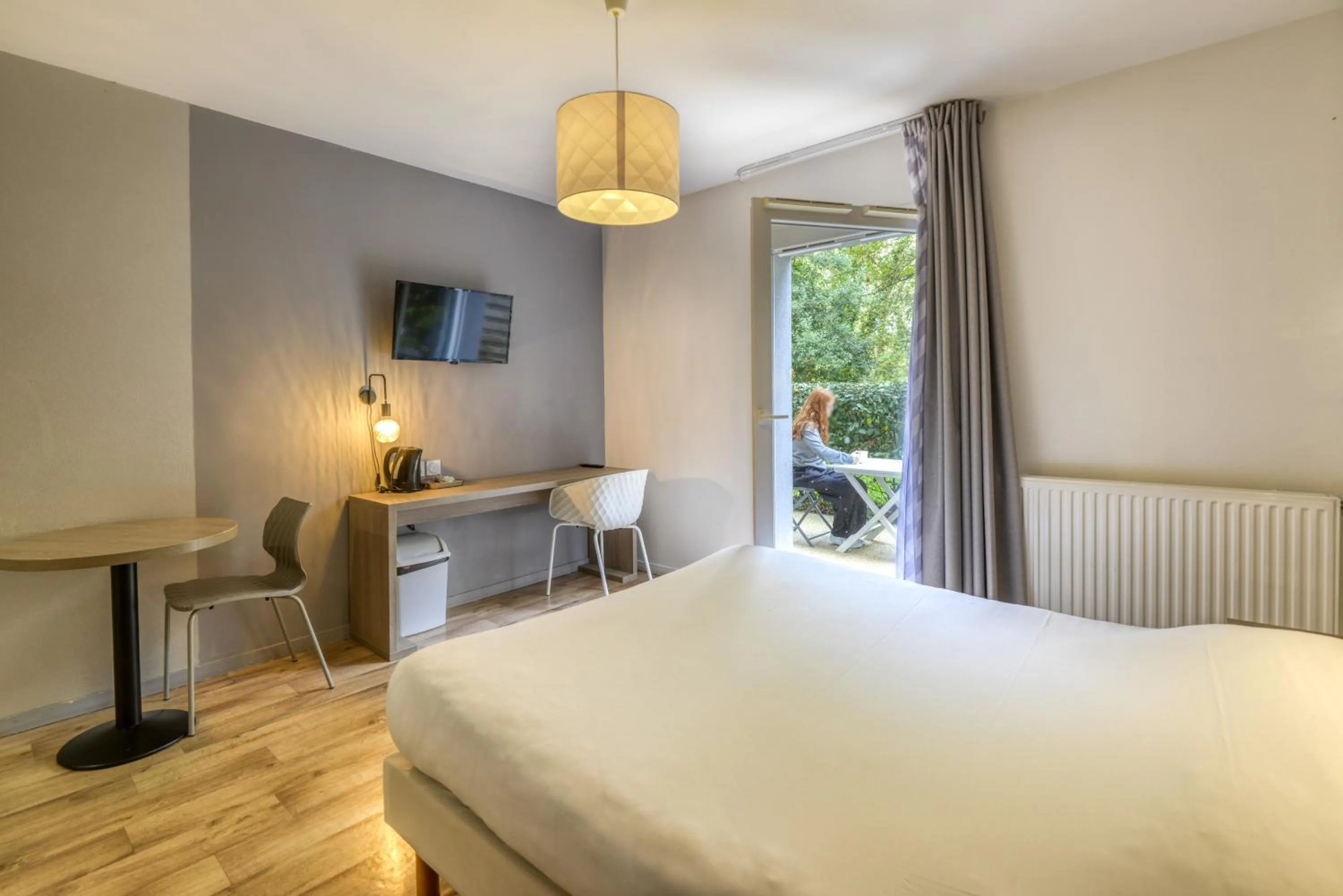 Patio, Bed in Aparthotel Adagio Access Saint Nazaire