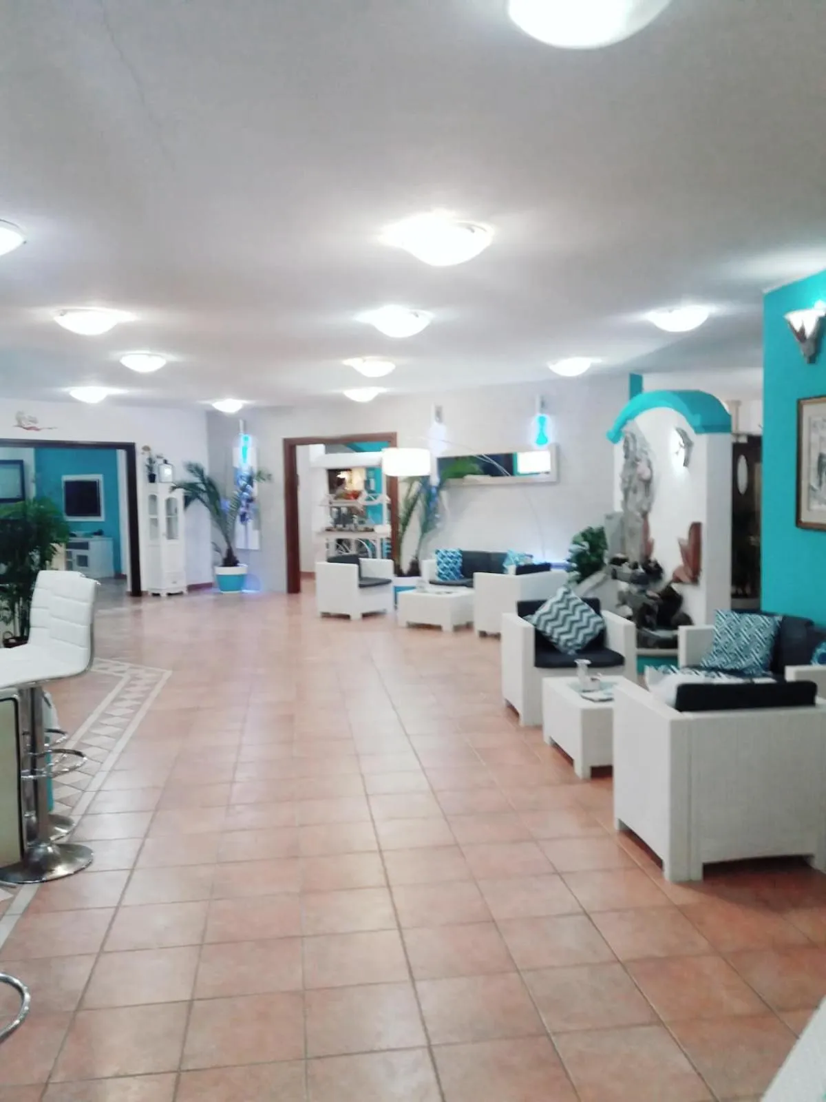 Communal lounge/ TV room in I Ginepri Hotel