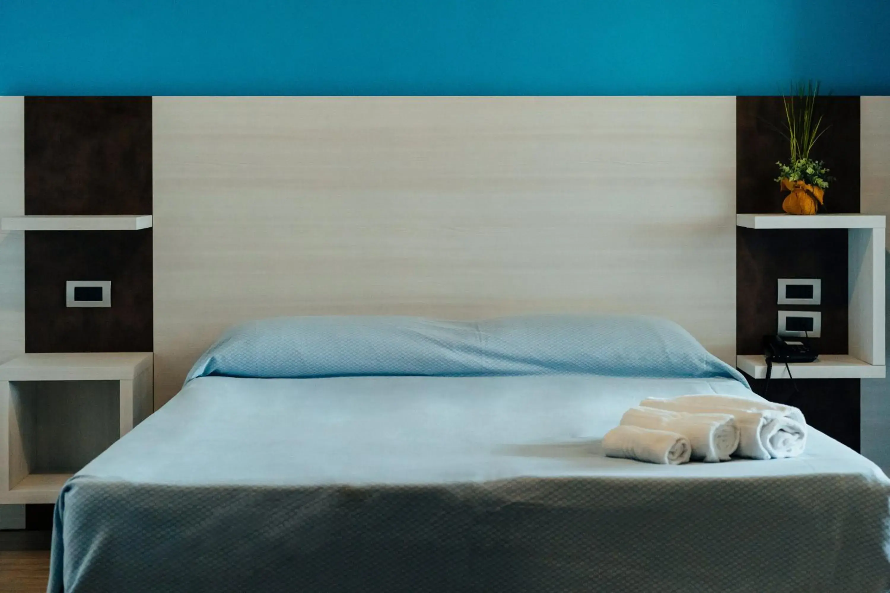 Bed in I Ginepri Hotel Bed in I Ginepri Hotel