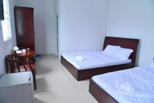 Bed in Xuan Anh Guesthouse, nhà nghỉ gia đình