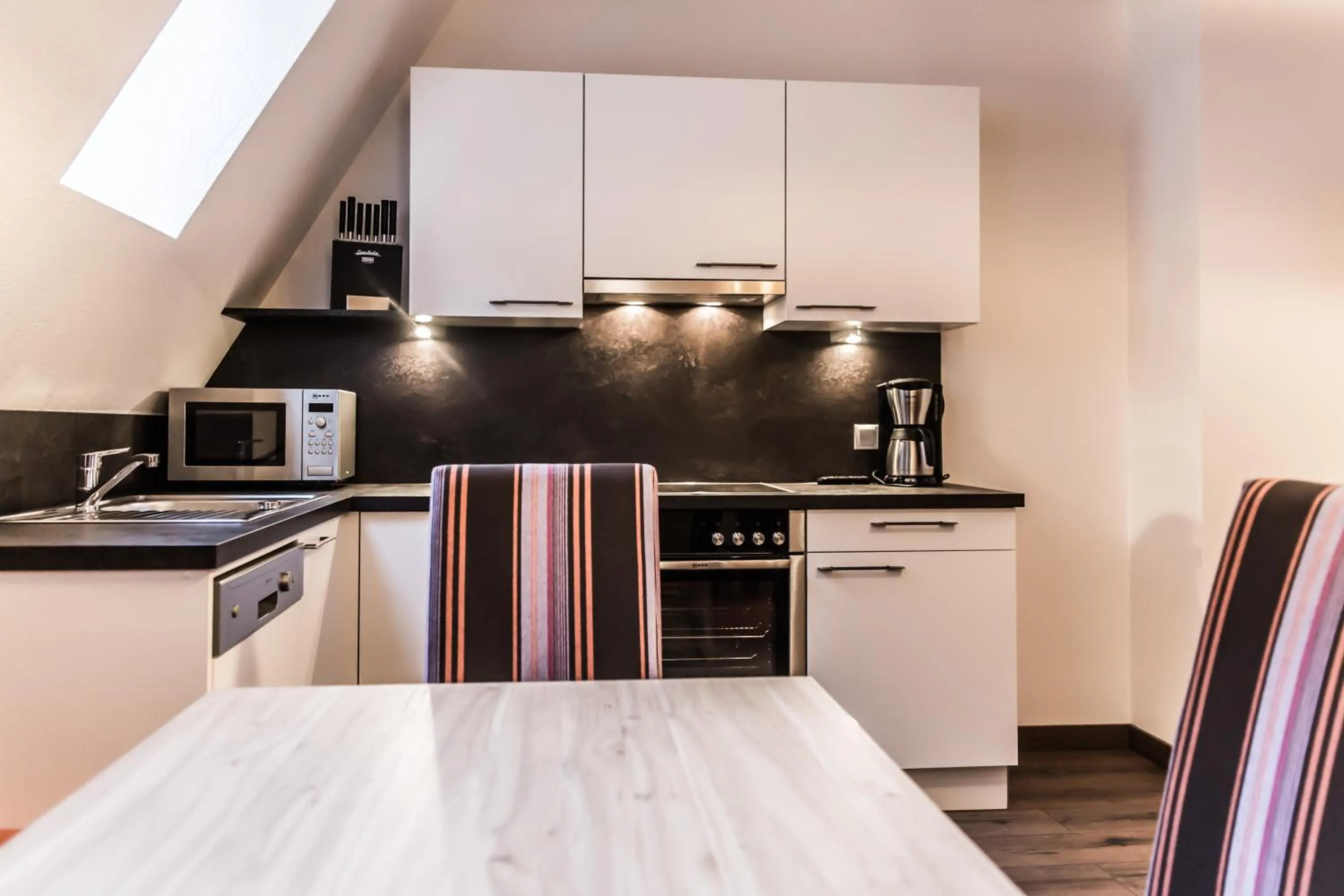 Kitchen or kitchenette in A Casa Smaragd Appartements