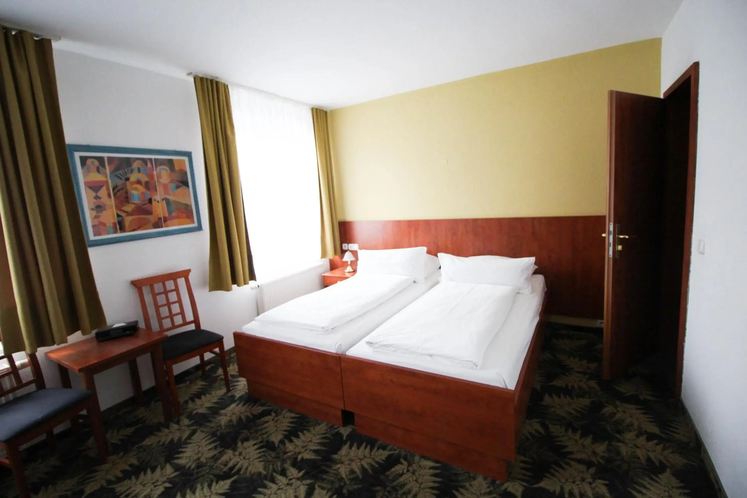 Photo of the whole room, Bed in Hotel Der Tannenbaum Photo of the whole room, Bed in Hotel Der Tannenbaum