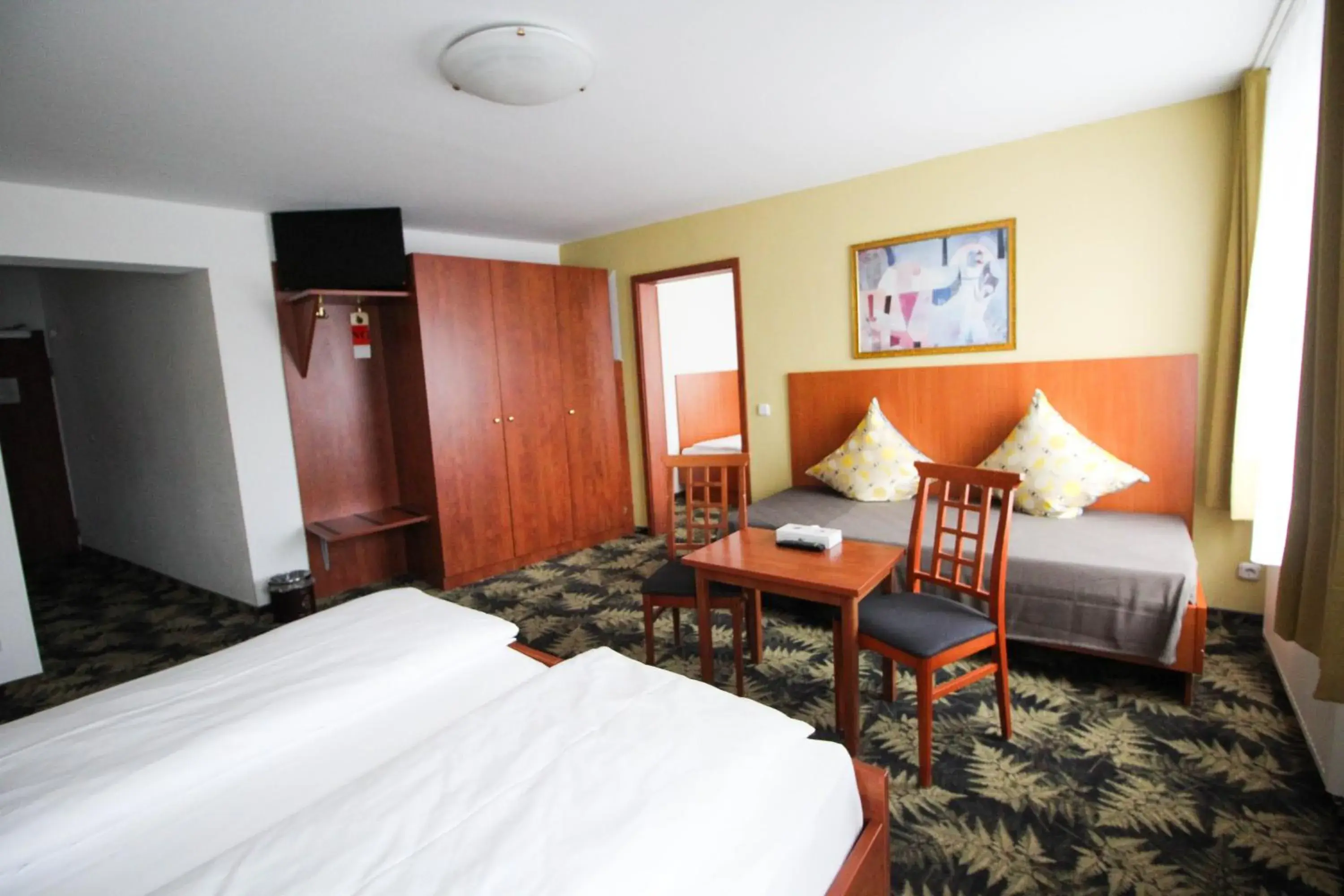 Photo of the whole room, Bed in Hotel Der Tannenbaum Photo of the whole room, Bed in Hotel Der Tannenbaum