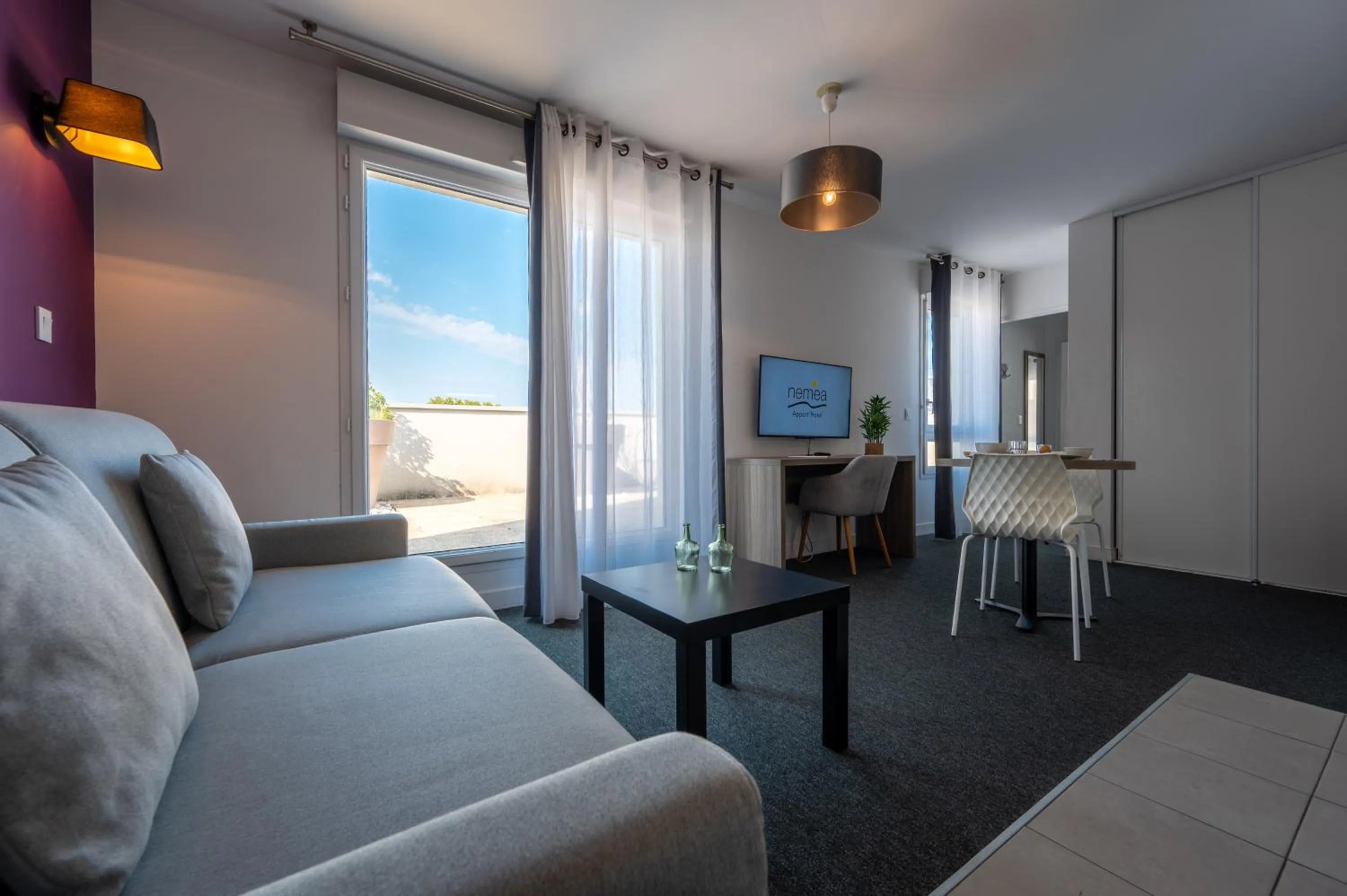 Seating area in Nemea Appart Hotel Quai Victor Tours Centre