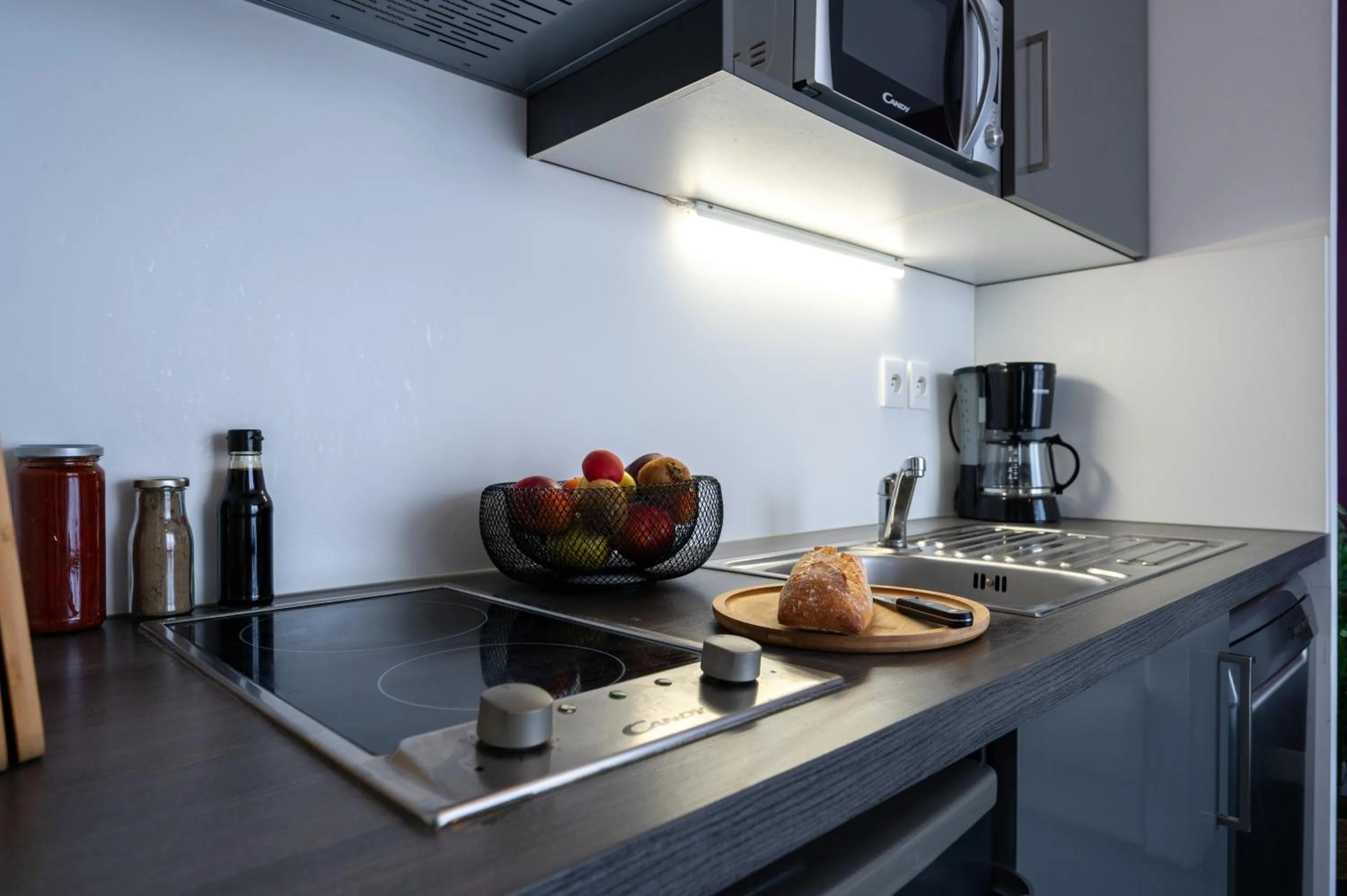 Kitchen or kitchenette in Nemea Appart Hotel Quai Victor Tours Centre