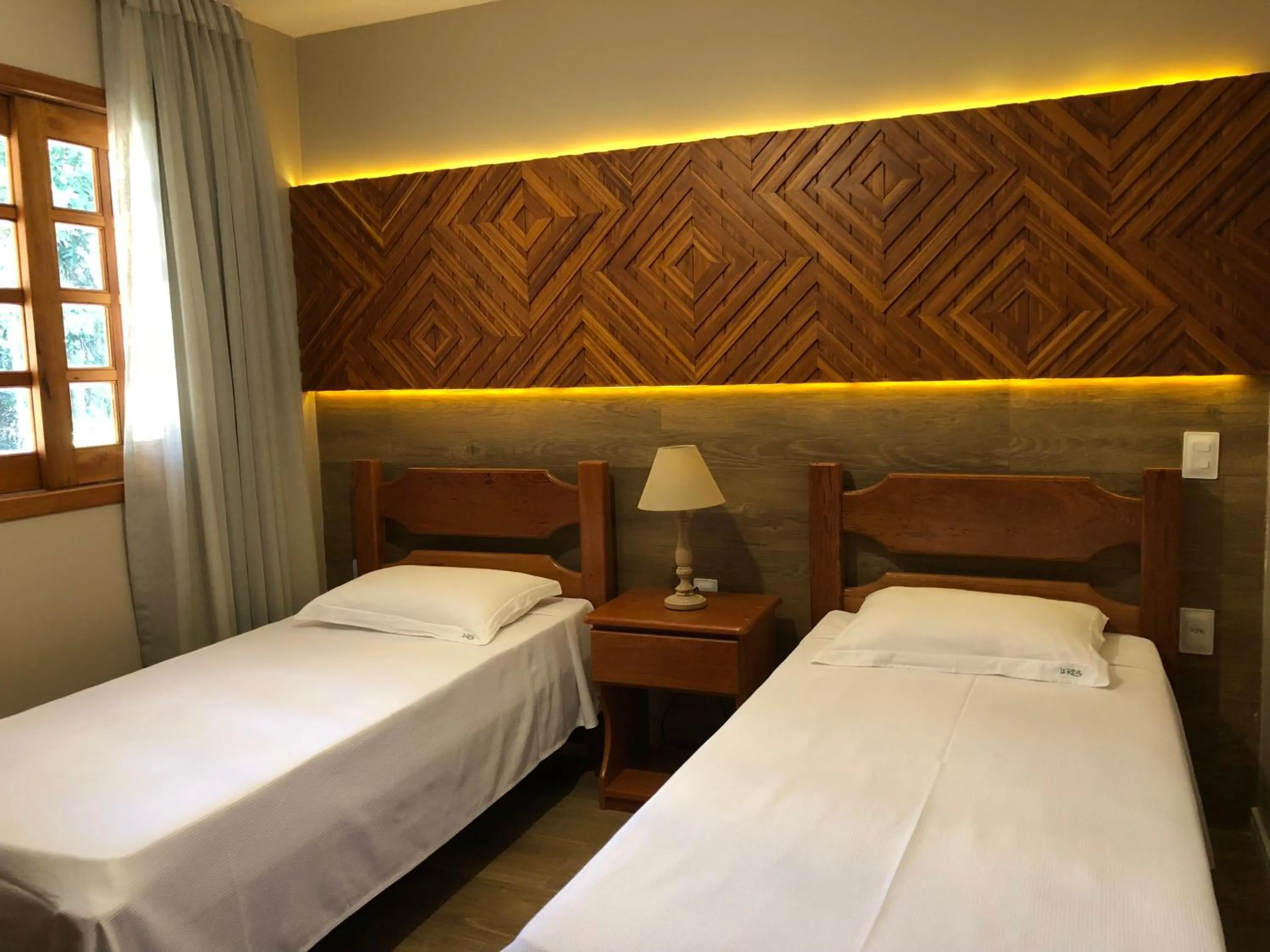 Bed in Le Rêve Pousada e Restaurante