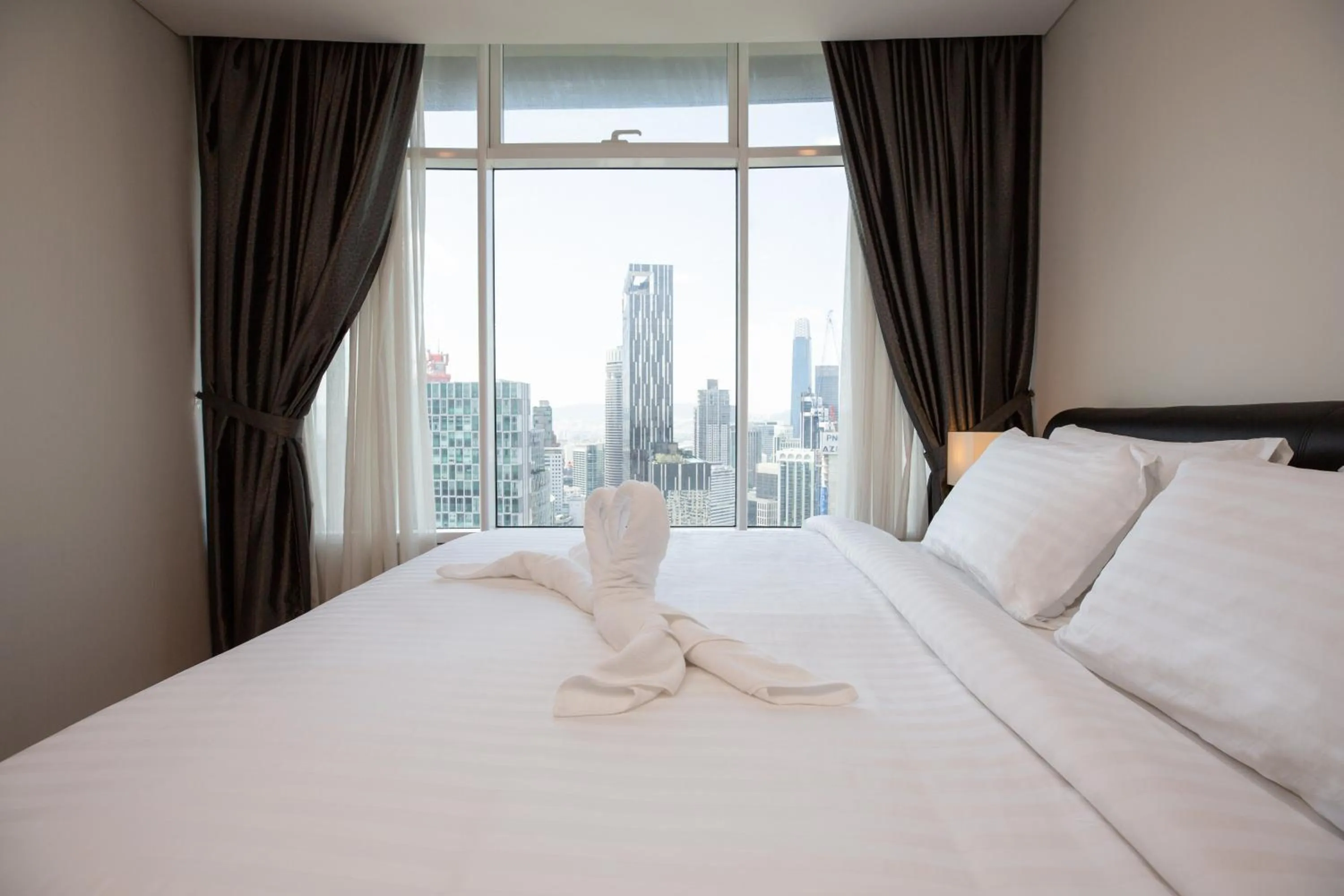 Bed in Vortex KLCC by Luxury Suites Asia