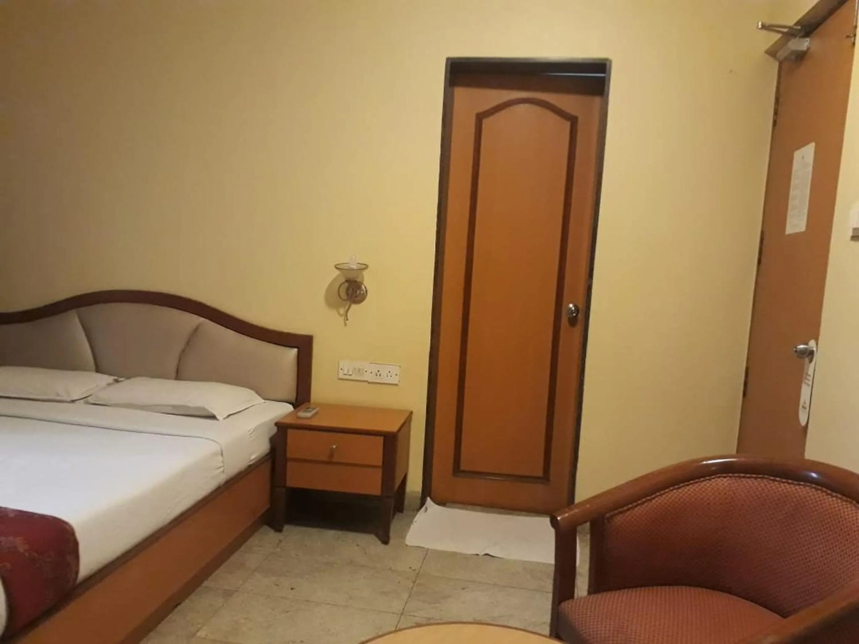 Bed in The Samrat Hotel near Pune Railway Station
