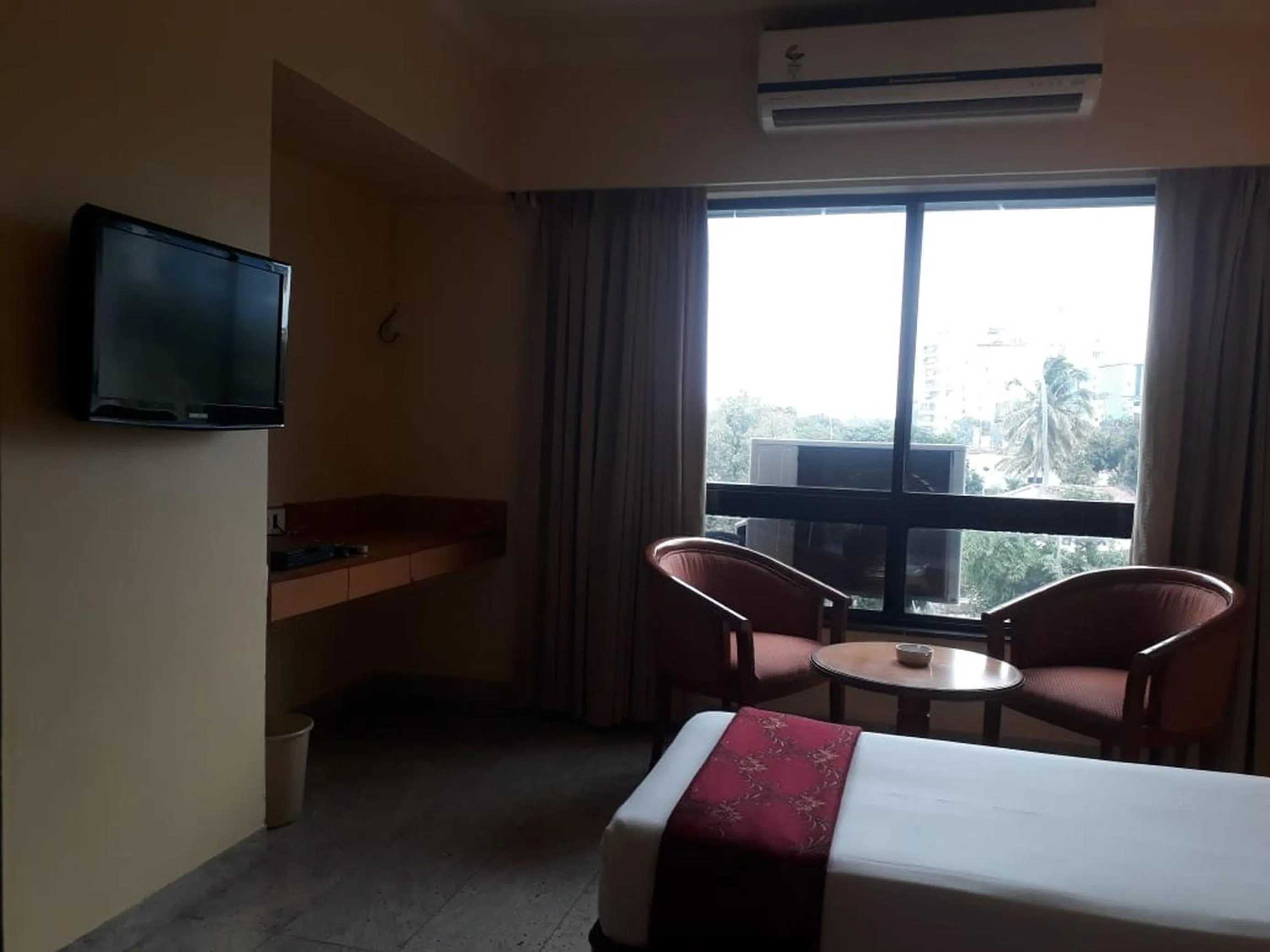 Bed in The Samrat Hotel near Pune Railway Station