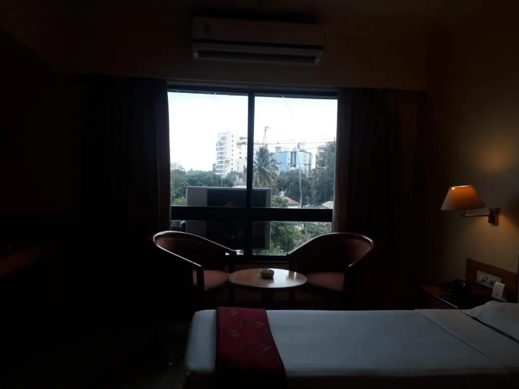Bed in The Samrat Hotel near Pune Railway Station